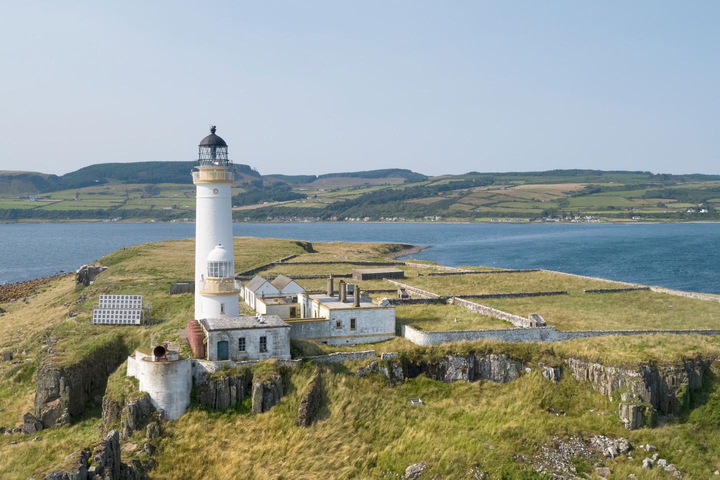 A lighthouse, a log cabin, and a schoolhouse: These quirky home listings cost less than the average home in the U.S.
