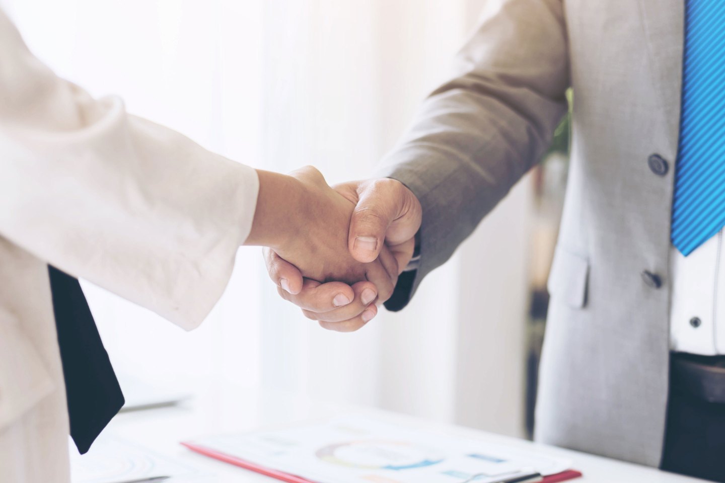 close up hand of business people shaking hands