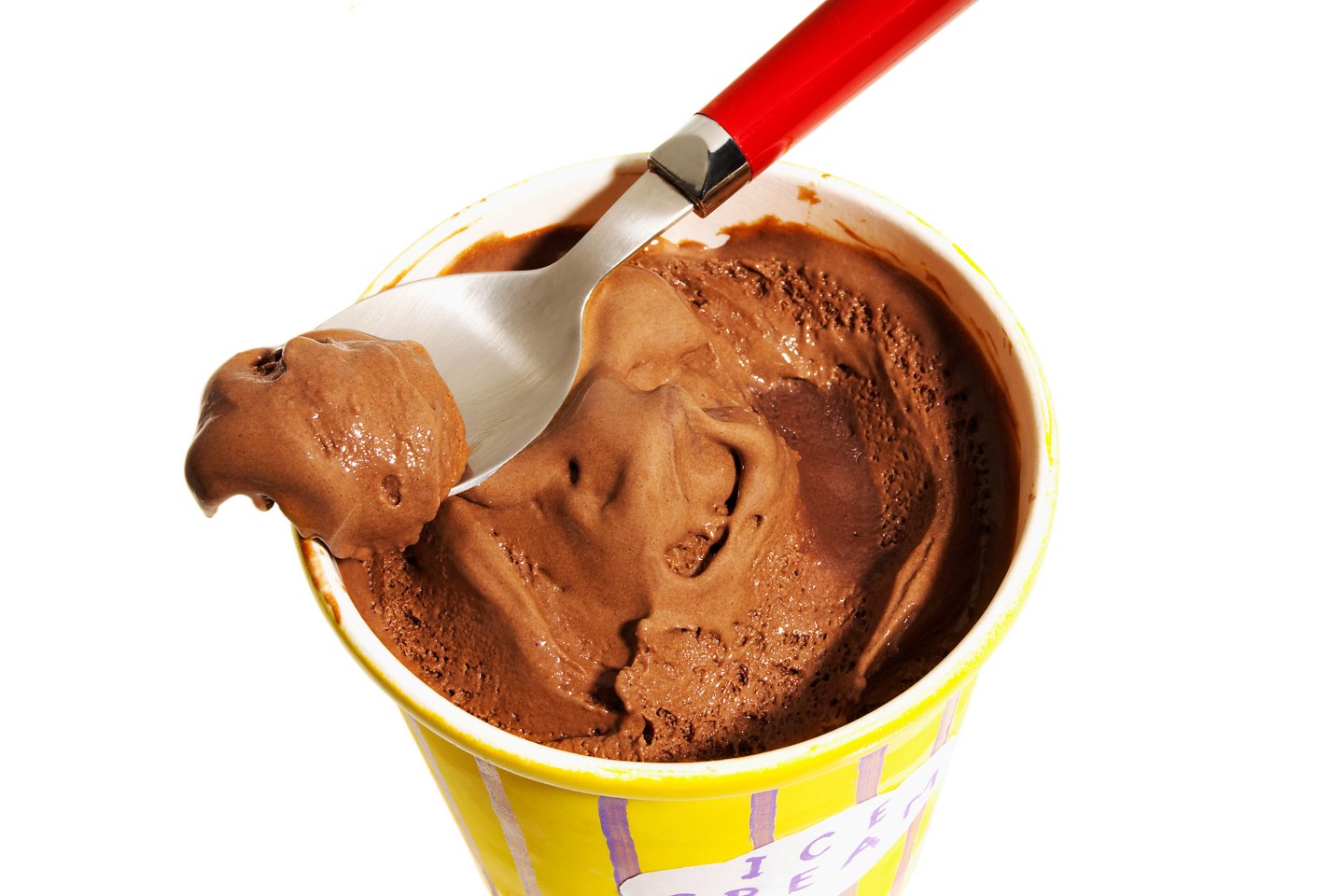 Pint of chocolate ice cream with red handled spoon, close-up