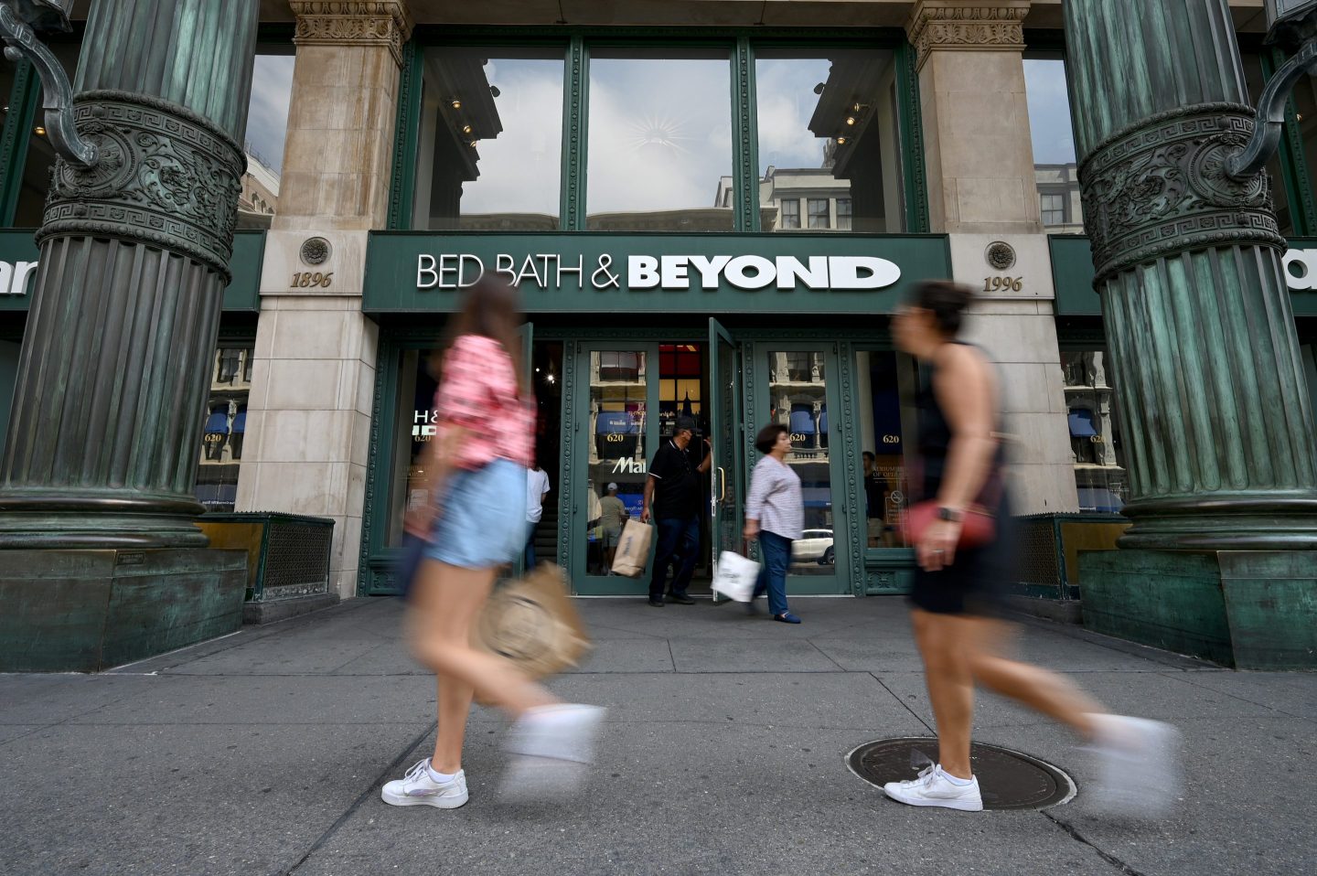 People walk past the entrance to Bed Bath & Beyond on Sixth Avenue in New York City.