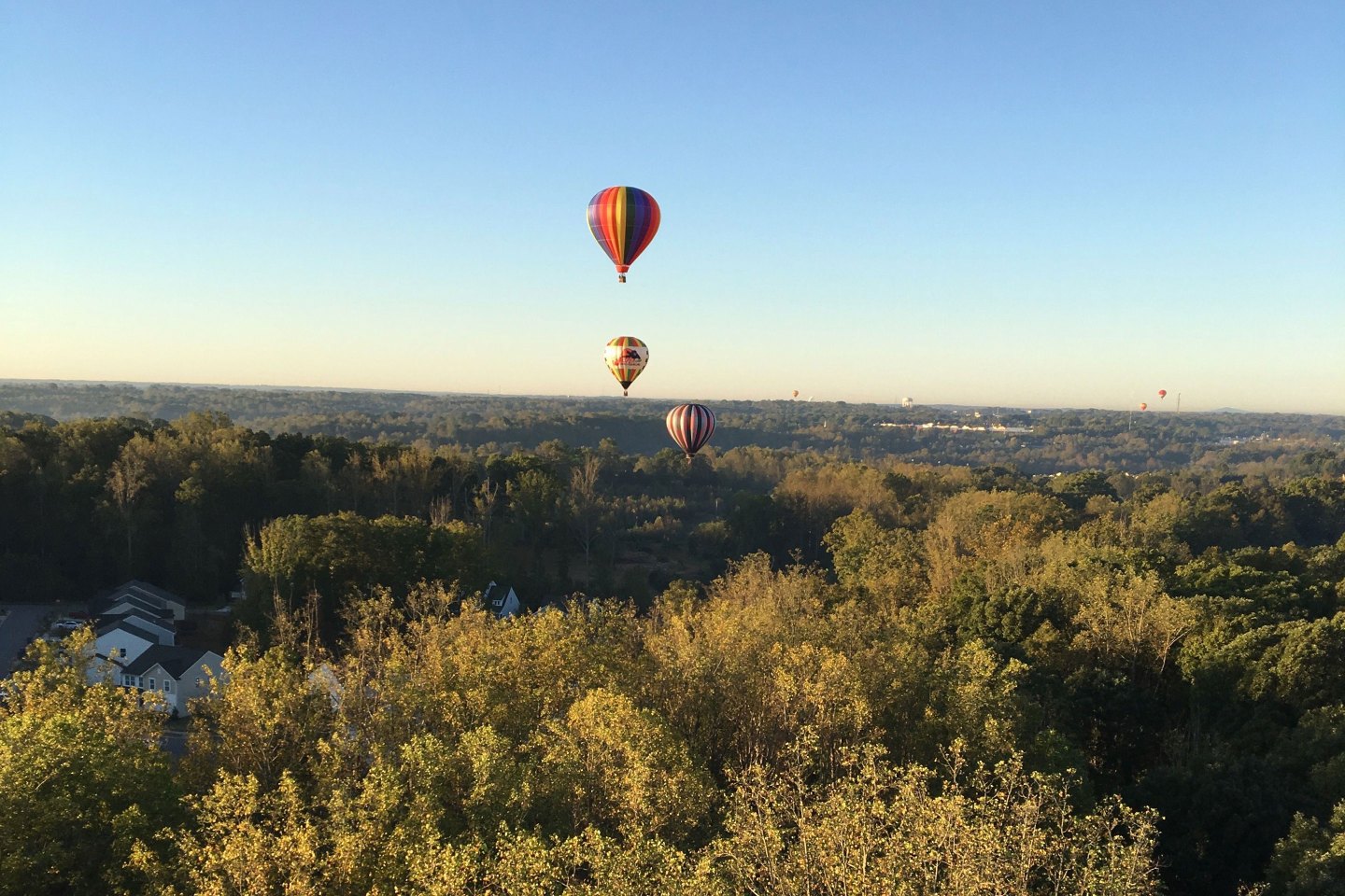 Colorful balloons glide silently over houses and treetops in Statesville at the annual Carolina BalloonFest.