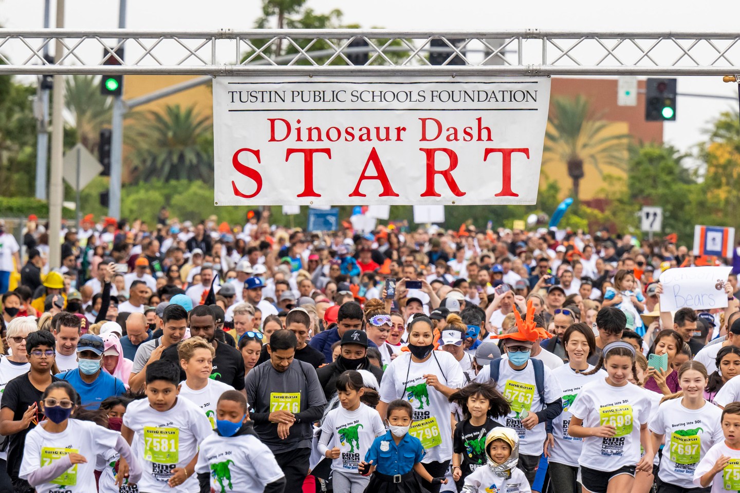 Hundreds of participants in the 2K Fun Run take off from the starting line at the 30th Dino Dash held by the Tustin Public Schools Foundation.