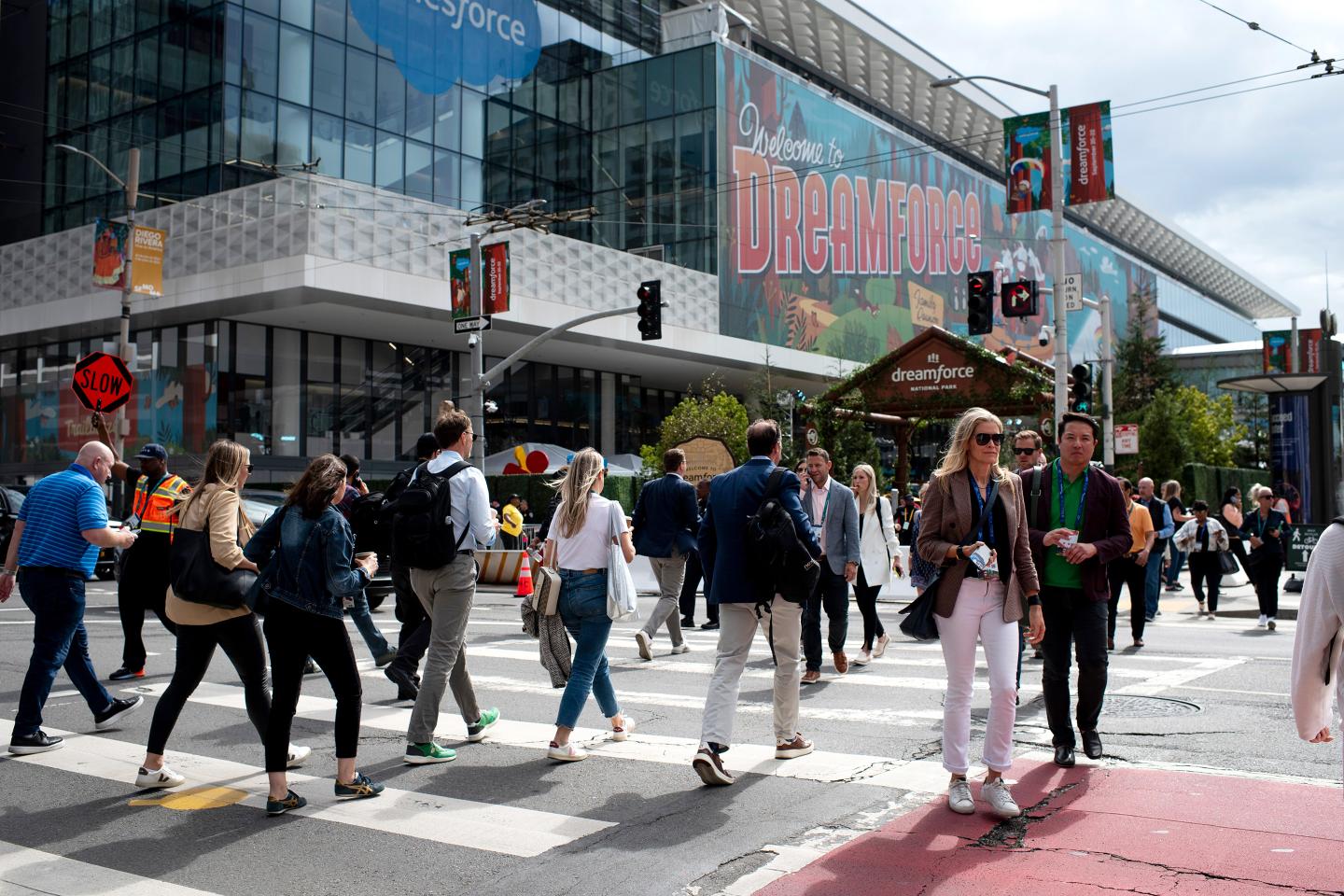 Attendees cross Third Street outside the 2022 Dreamforce conference in San Francisco, California.