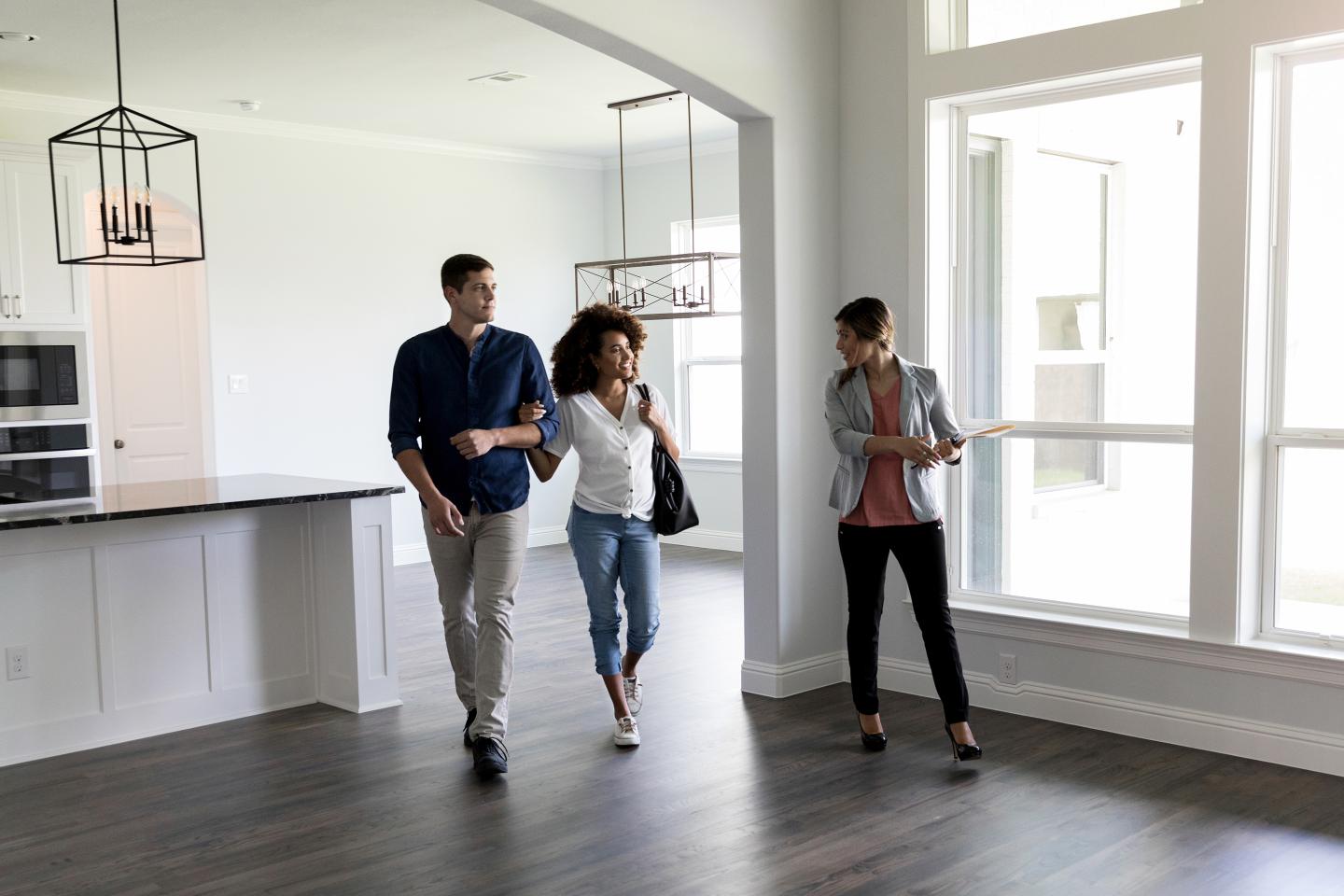 Young couple looking at their first home.