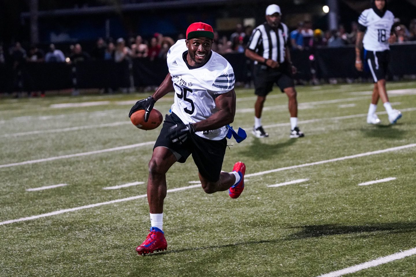 Former football running back Reggie Bush plays flag football.