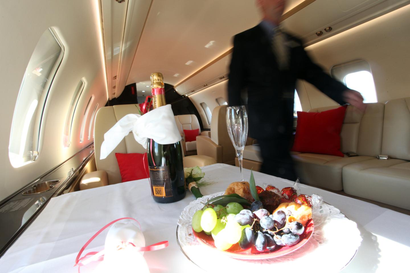a bottle of champagne inside a private jet