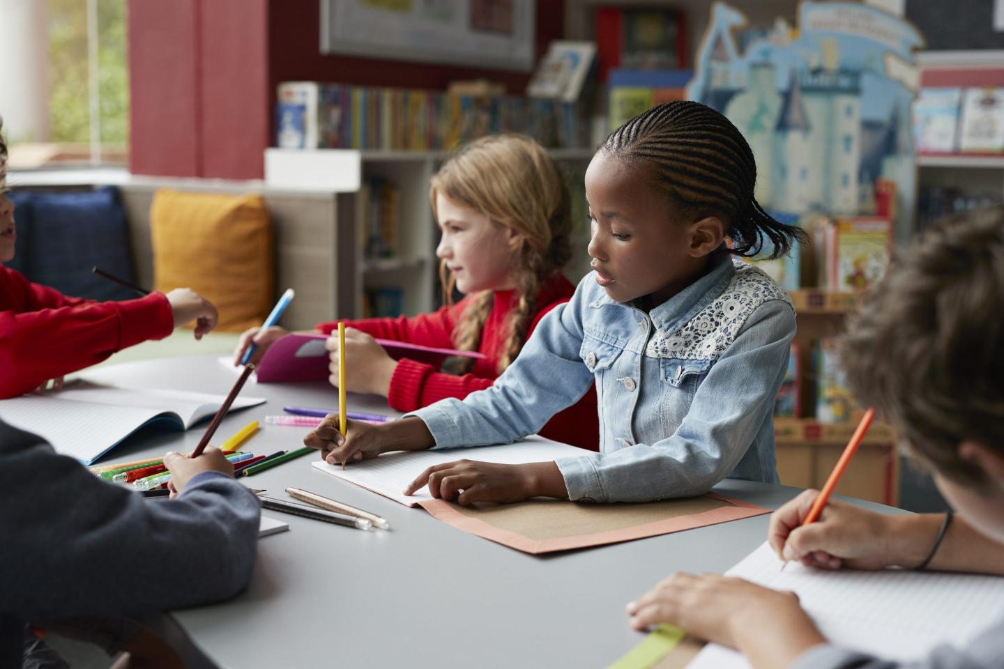School children drawing at the school library