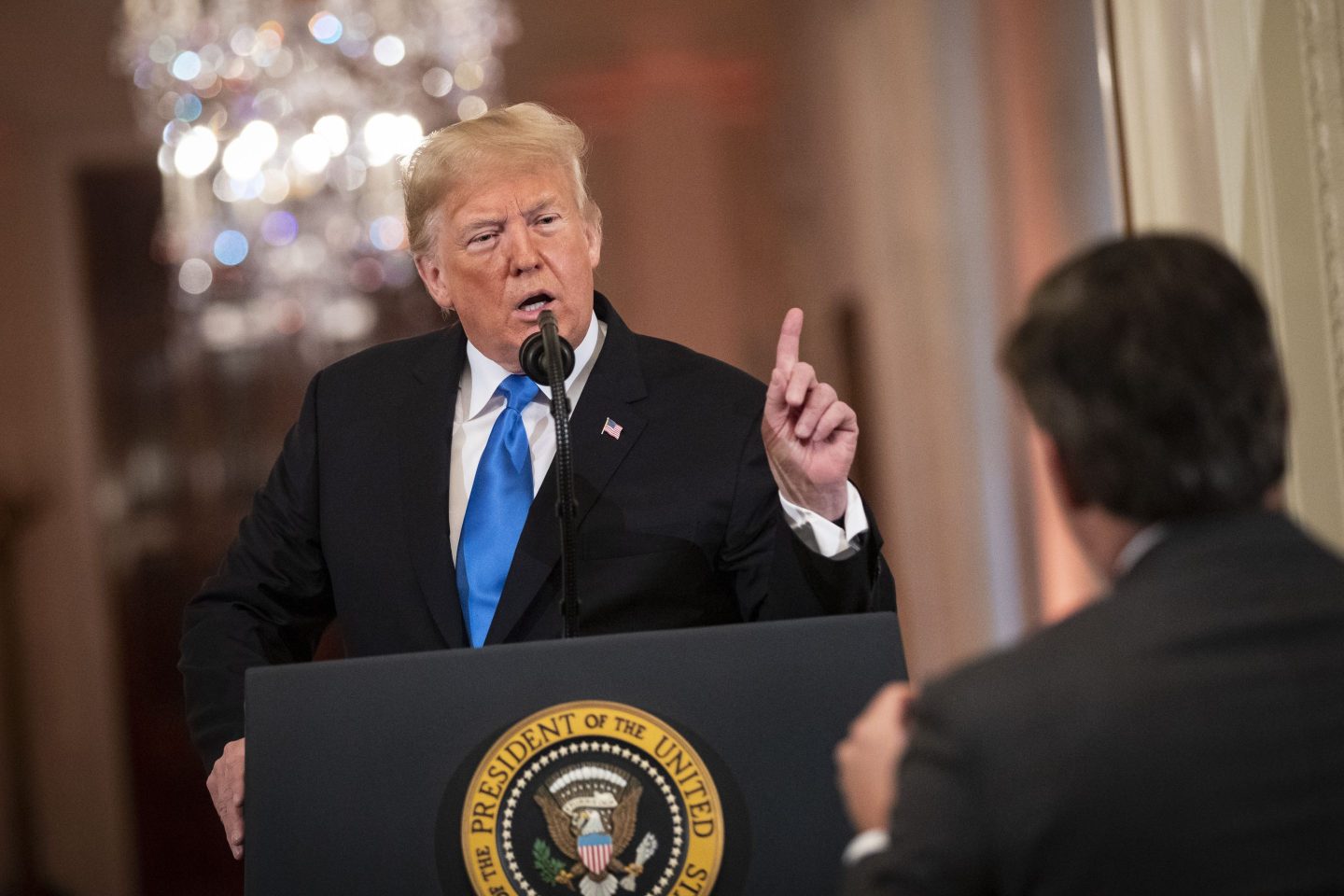 U.S. President Donald Trump argues with CNN reporter Jim Acosta