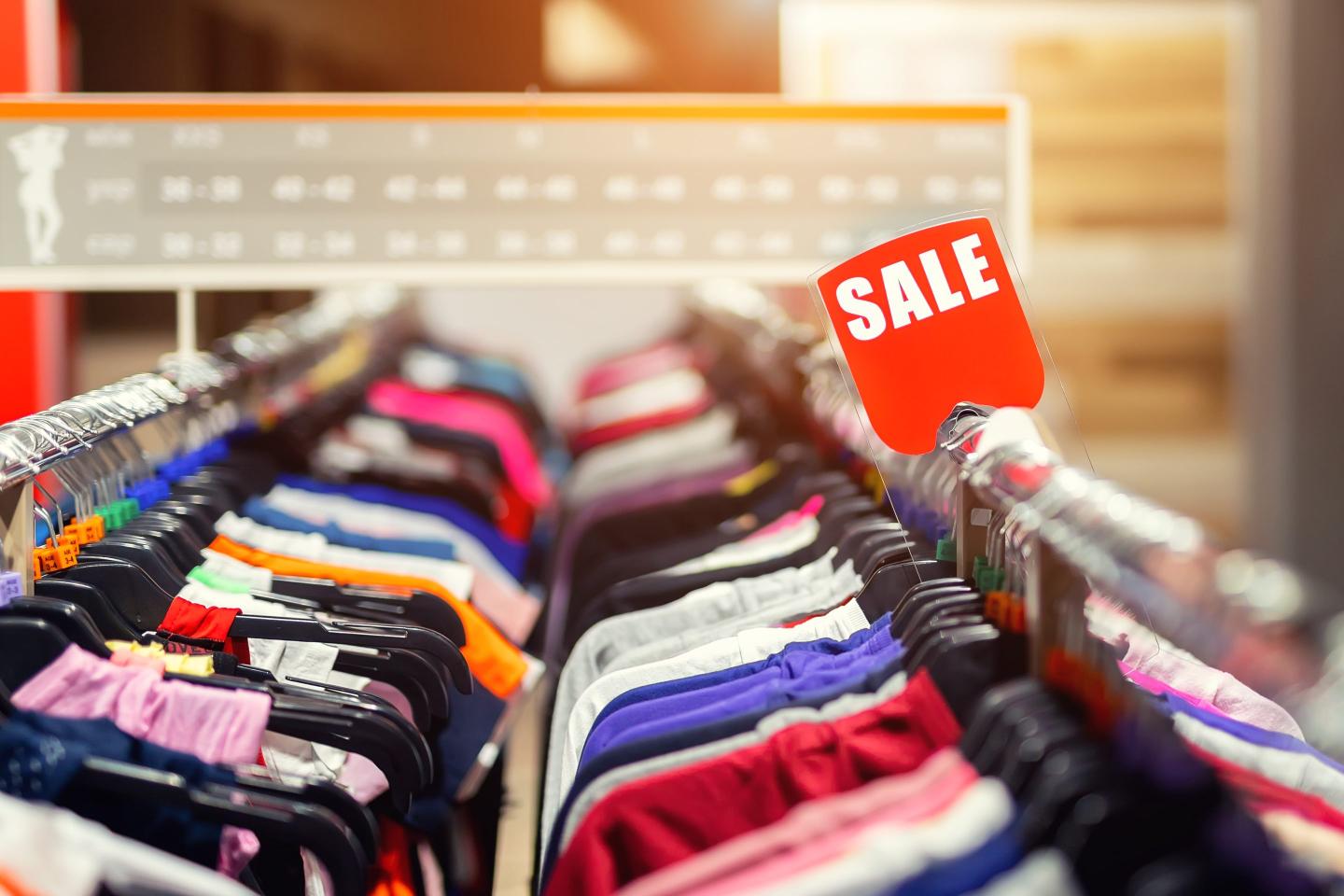 A close-up of clothes for sale in a store.