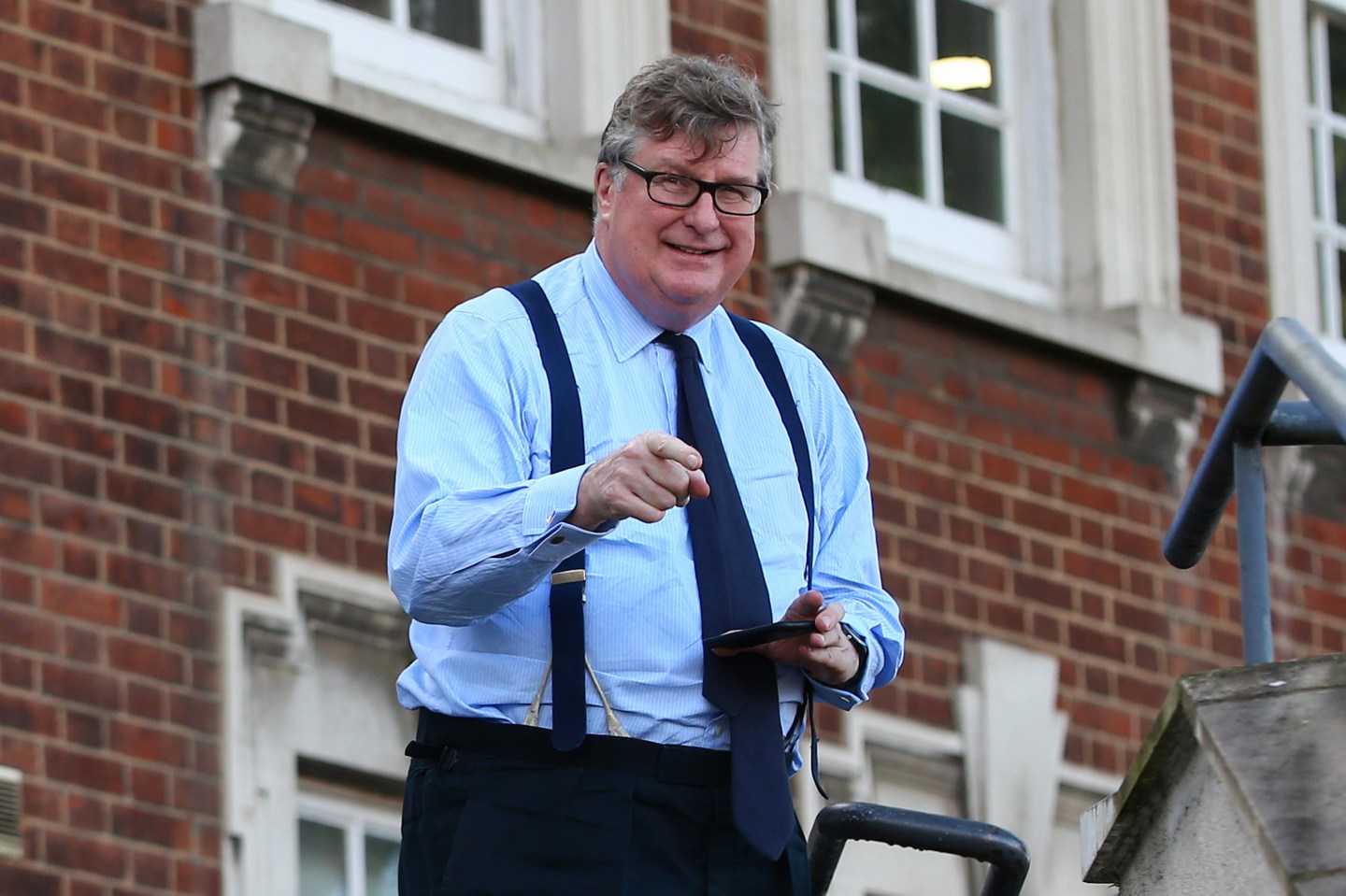 Crispin Odey, founding partner of Odey Asset Management, gestures outside Hendon Magistrates' Court during a break in proceedings in London, on Feb. 18, 2021.
