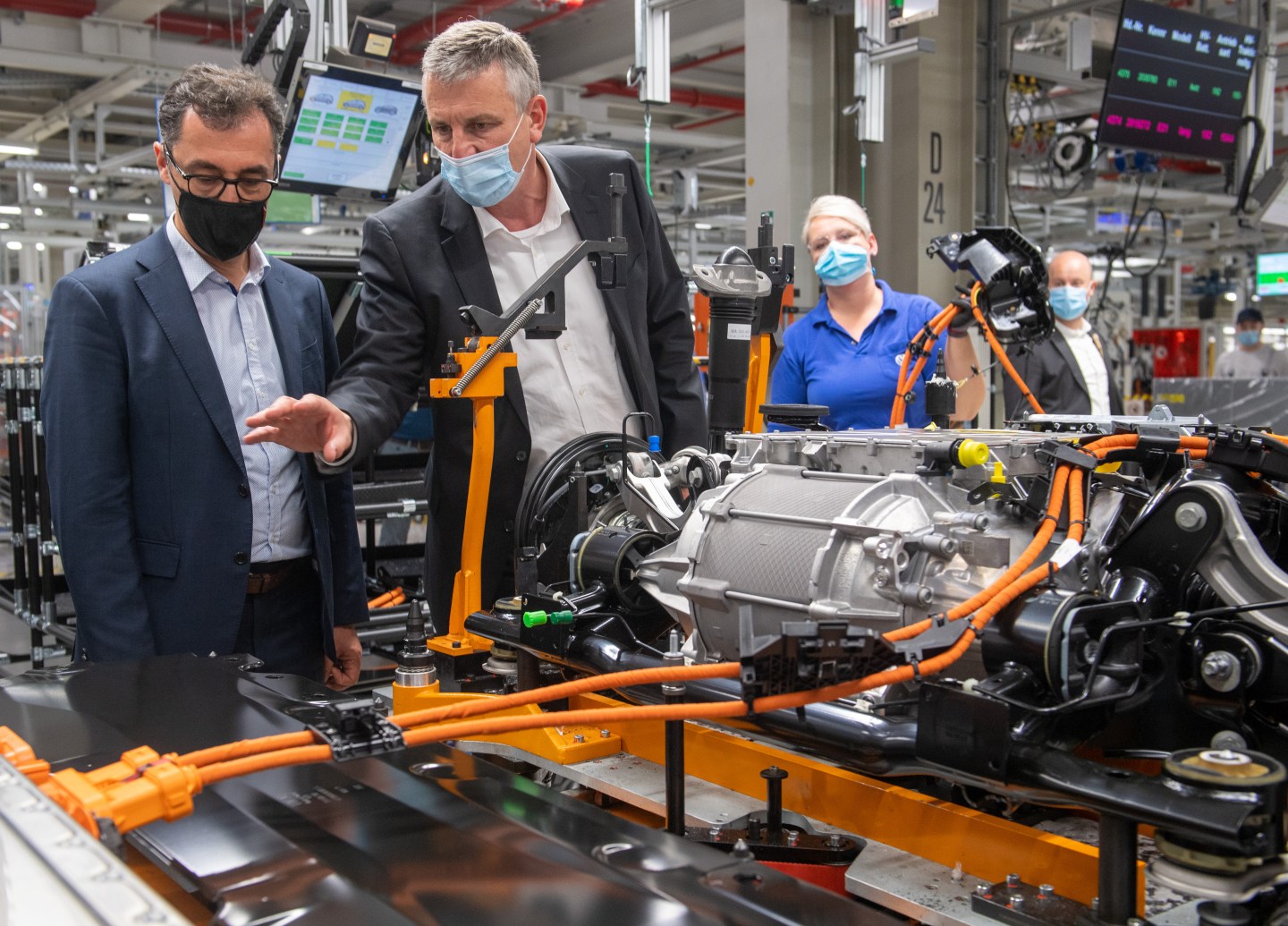 German politician Cem Ozdemir (left) gets a tour of a Volkswagen factory in Zwickau on June 3rd from VW executive Stefan Loth (right).