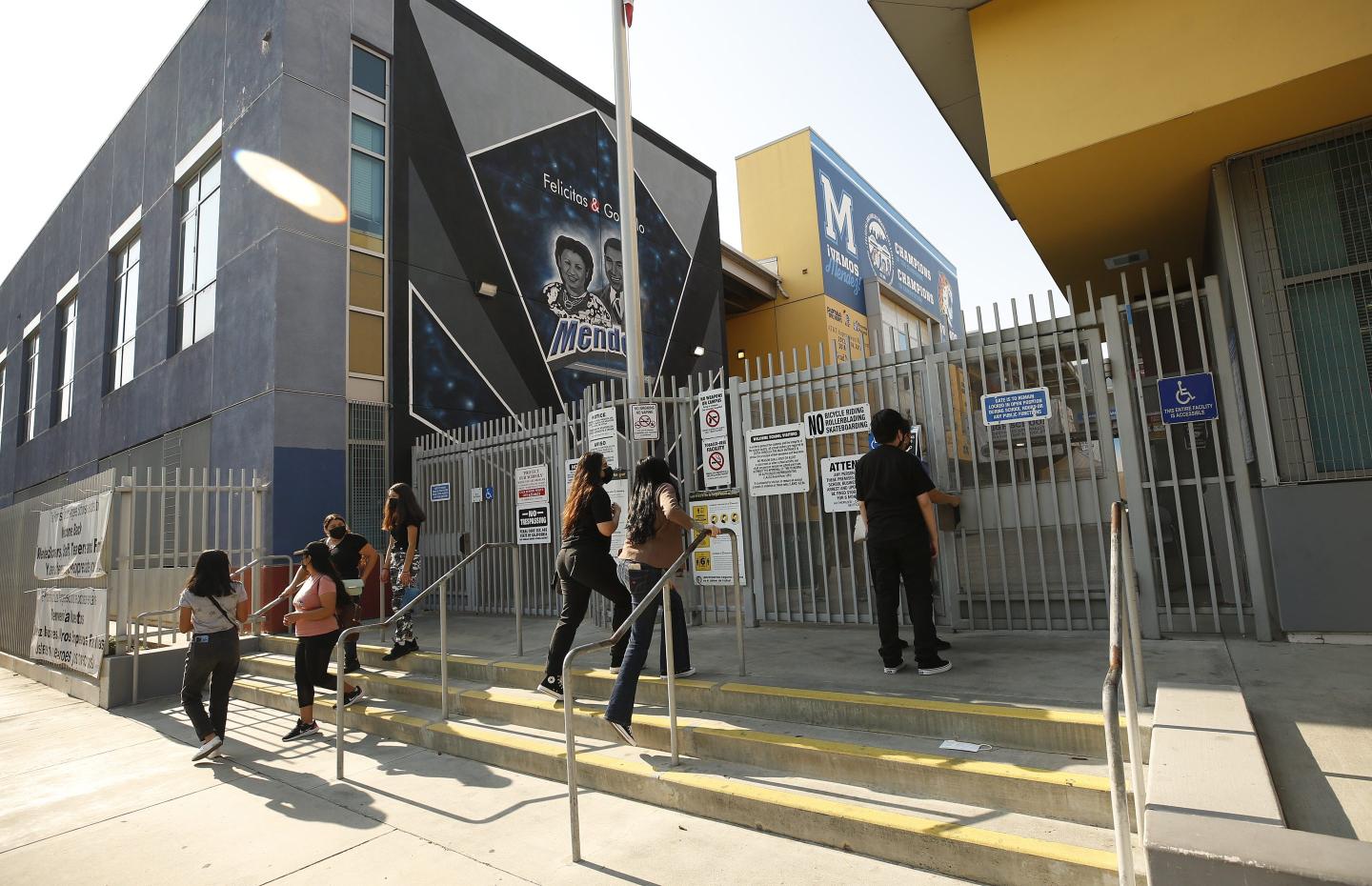 Students arrive at Mendez High School in Los Angeles. 