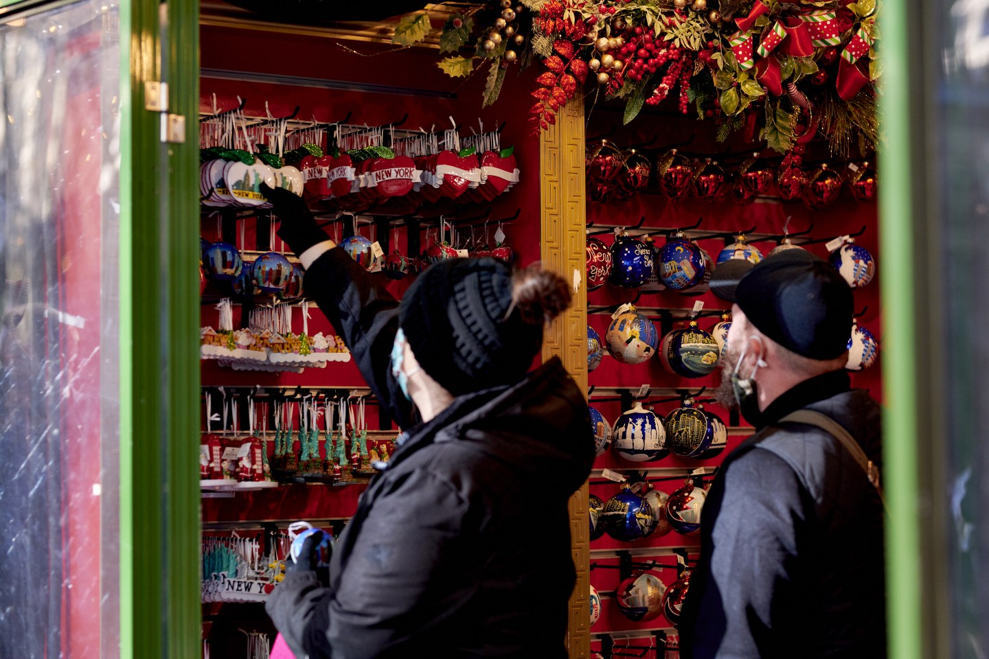 Shoppers view ornaments for sale at the Urbanspace Holiday Shops at Bryant Park in New York, December 2021.