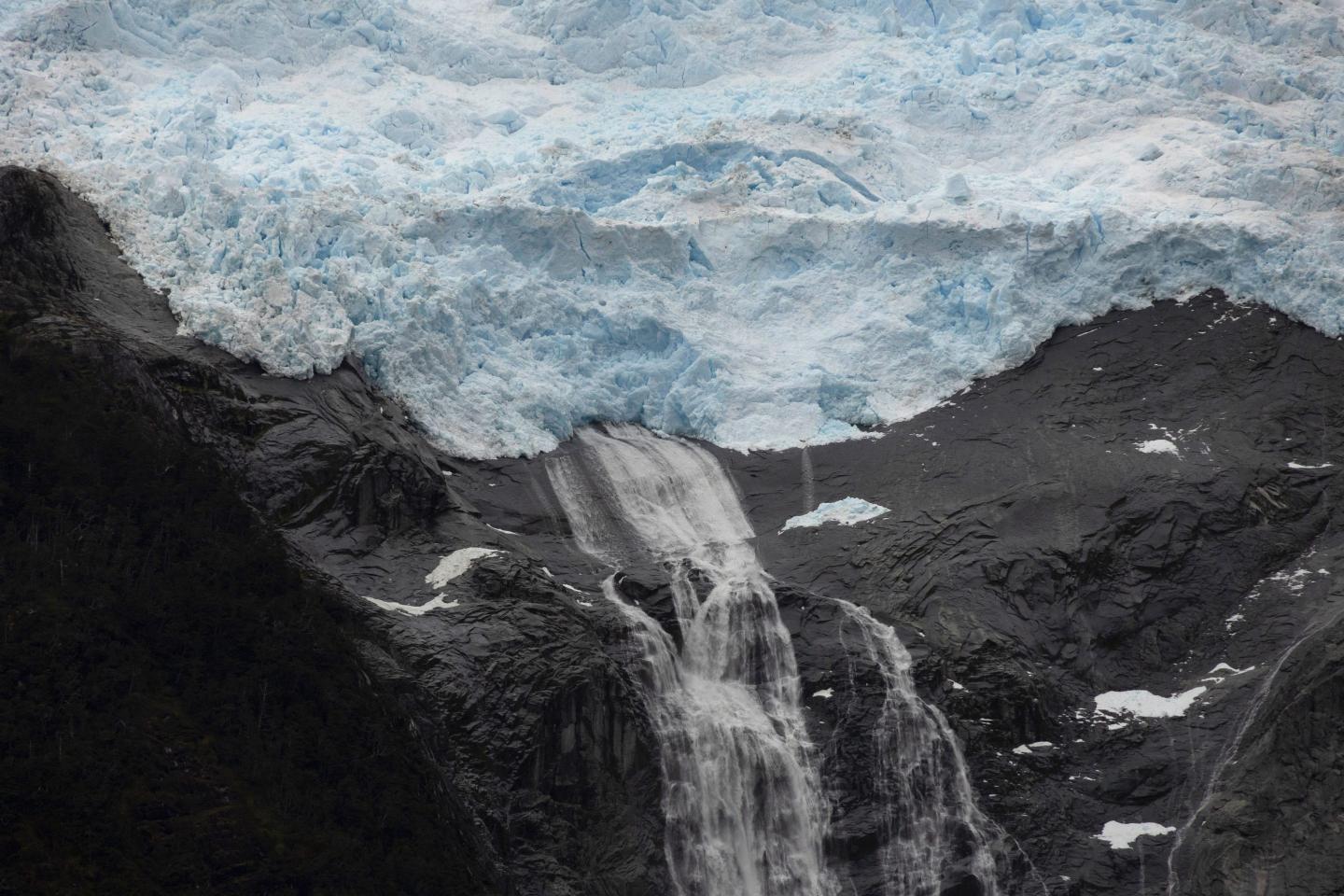 the Romanche glacier, located in the northwest arm of the Beagle Channel, in southern Chile's region of Magallanes, with a river of water spouting from the base of the glacier