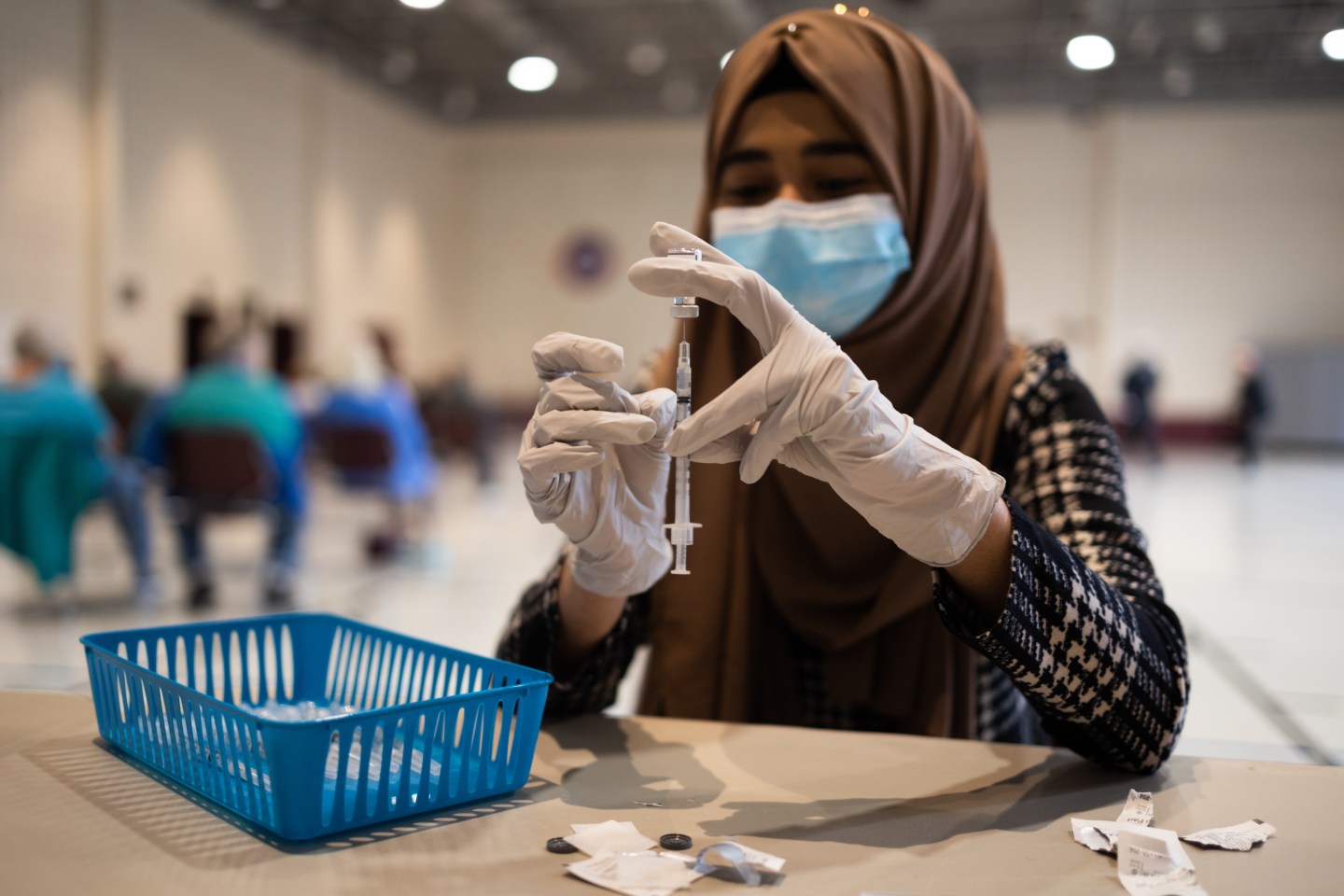 A health care worker prepares a Pfizer booster shot in Pennsylvania