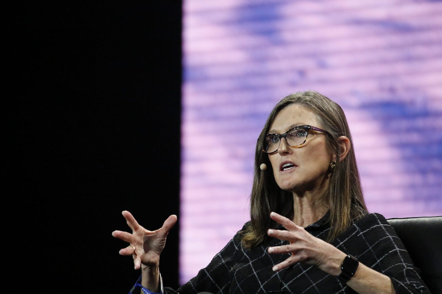 Cathie Wood, chief executive officer and chief investment officer, Ark Invest, gestures as she speaks during the Bitcoin 2022 Conference at Miami Beach Convention Center on April 7th in Miami.