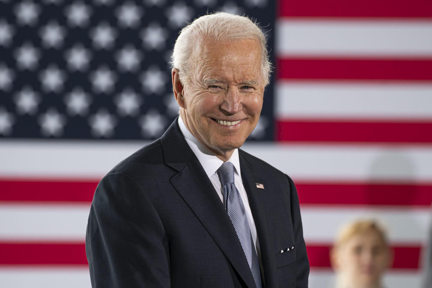 Joe Biden in front of an American flag.