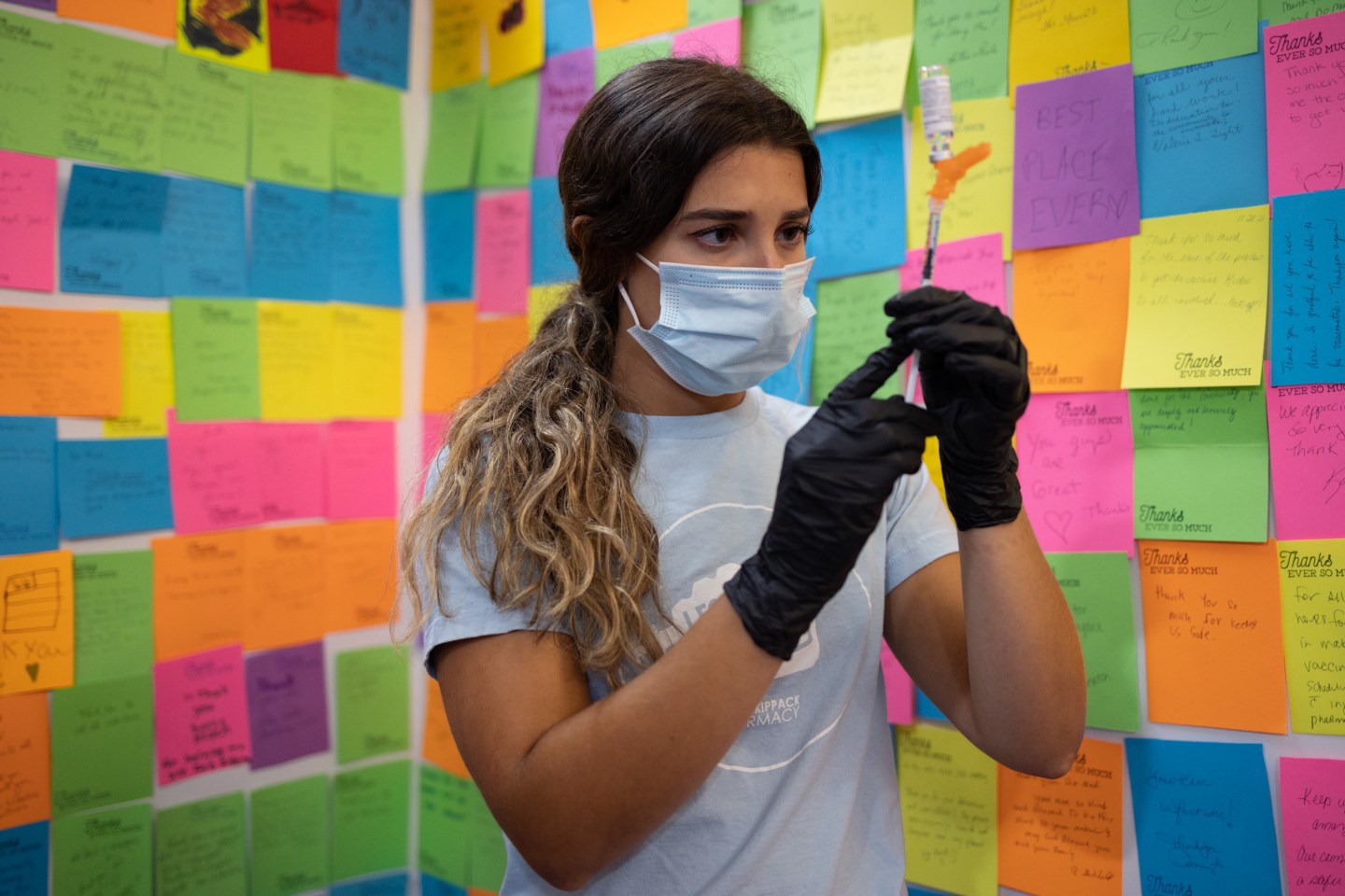 A healthcare worker prepares a dose of the Novavax COVID-19 vaccine at a pharmacy in Schwenksville, Penn., on Aug. 1. Novavax's protein-based COVID-19 vaccine received long-sought U.S. emergency-use authorization in July, but use is likely to be limited.