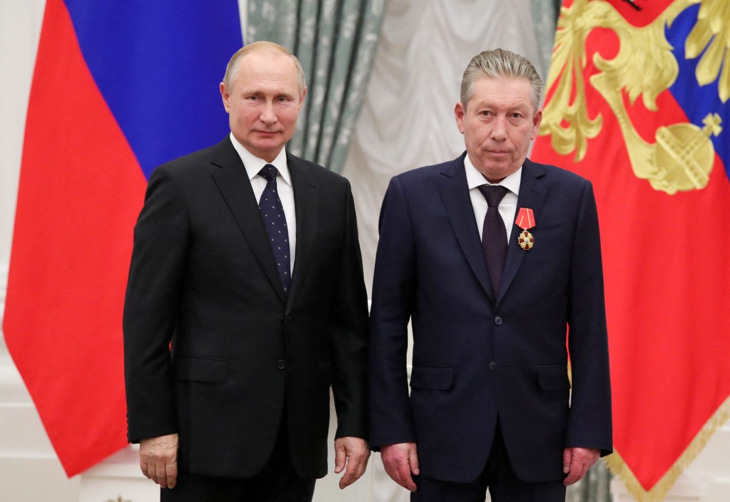 Russian President Vladimir Putin (left) and Lukoil chair Ravil Maganov attend a ceremony at the Kremlin on Nov. 21, 2019.