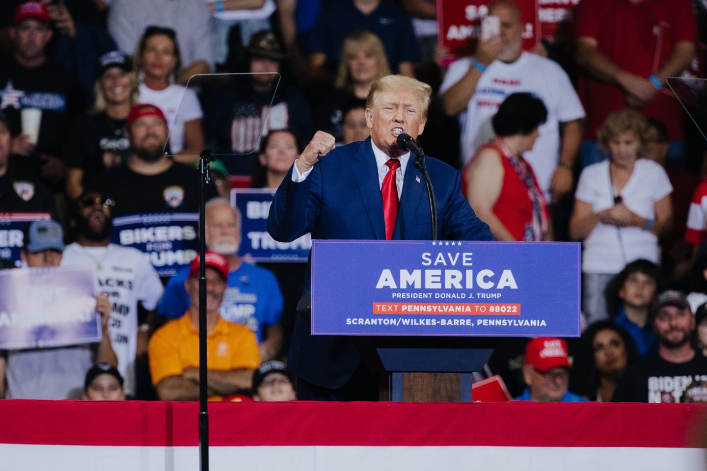 Donald Trump gestures as he speaks during a rally