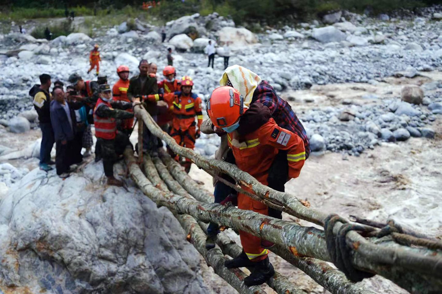 Chinese rescue workers evacuate residents in Sichuan after an earthquake