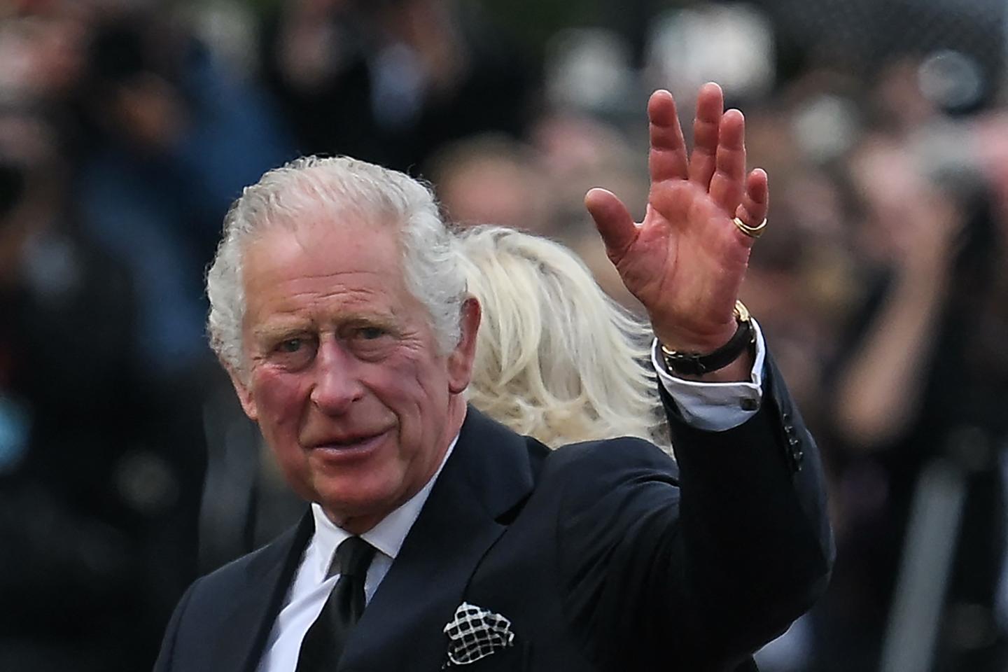 Britain's King Charles III and Britain's Camilla, Queen Consort greet the crowd upon their arrival Buckingham Palace in London the day after Queen Elizabeth II's death