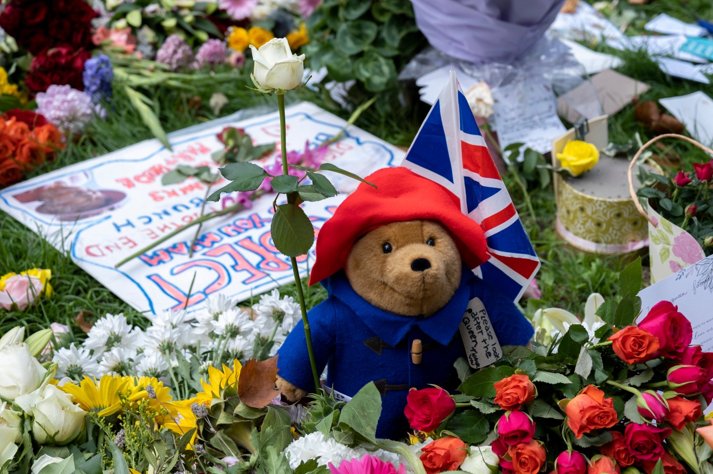 Close-up of floral tributes and a toy Paddington Bear at London’s Green Park on Sept. 11, 2022.
