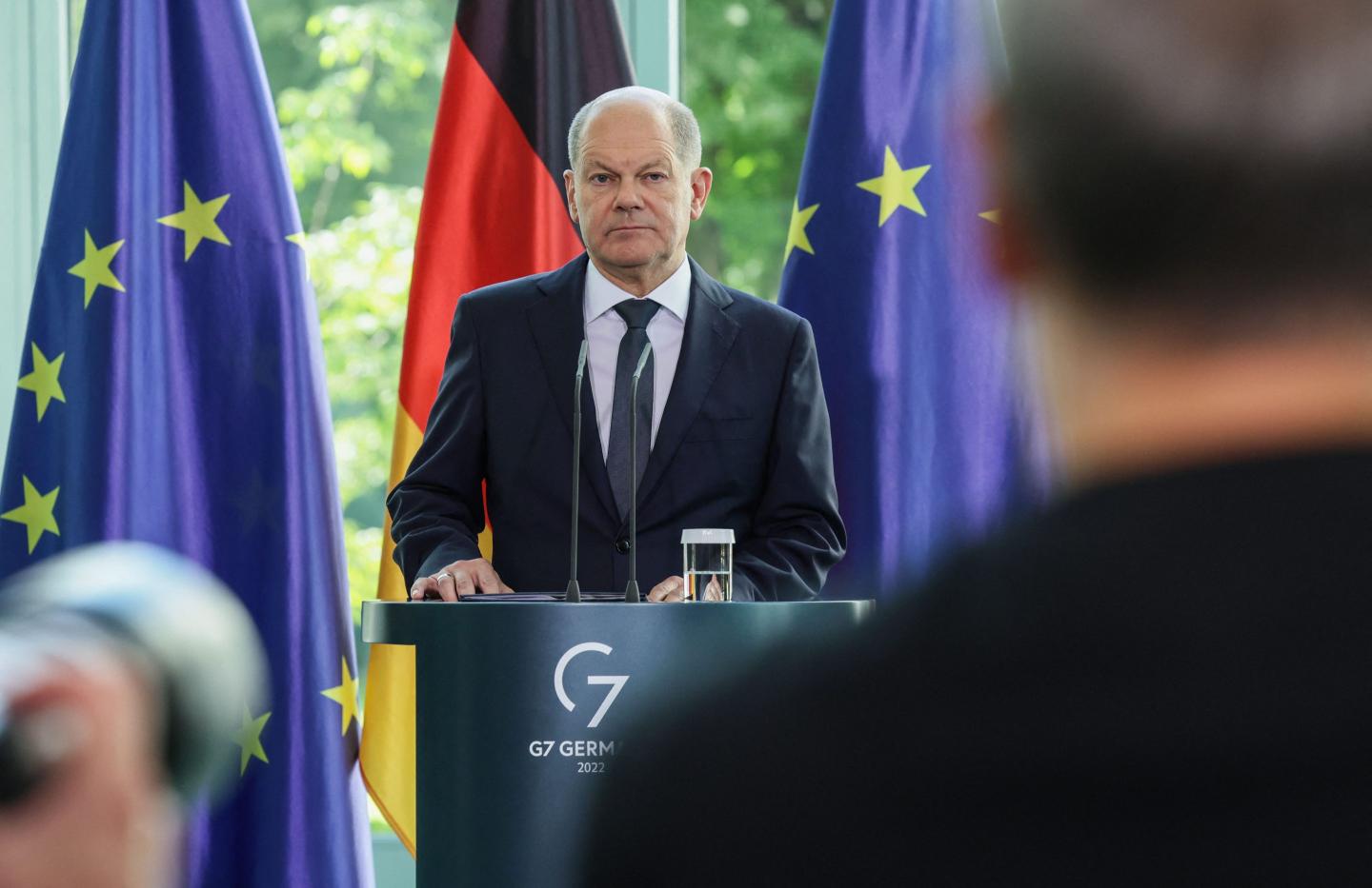 German Chancellor Olaf Scholz stands at the podium during a press conference in Berlin, Germany, on September 16, 2022.