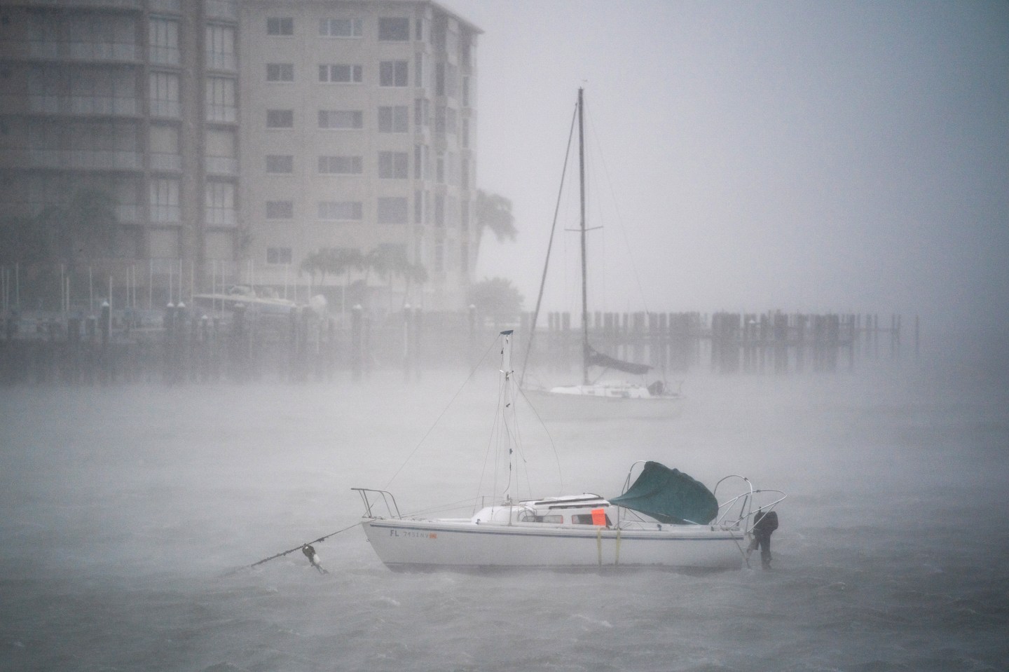 Wind gusts blow across boats in Sarasota Bay as during Hurricane Ian.
