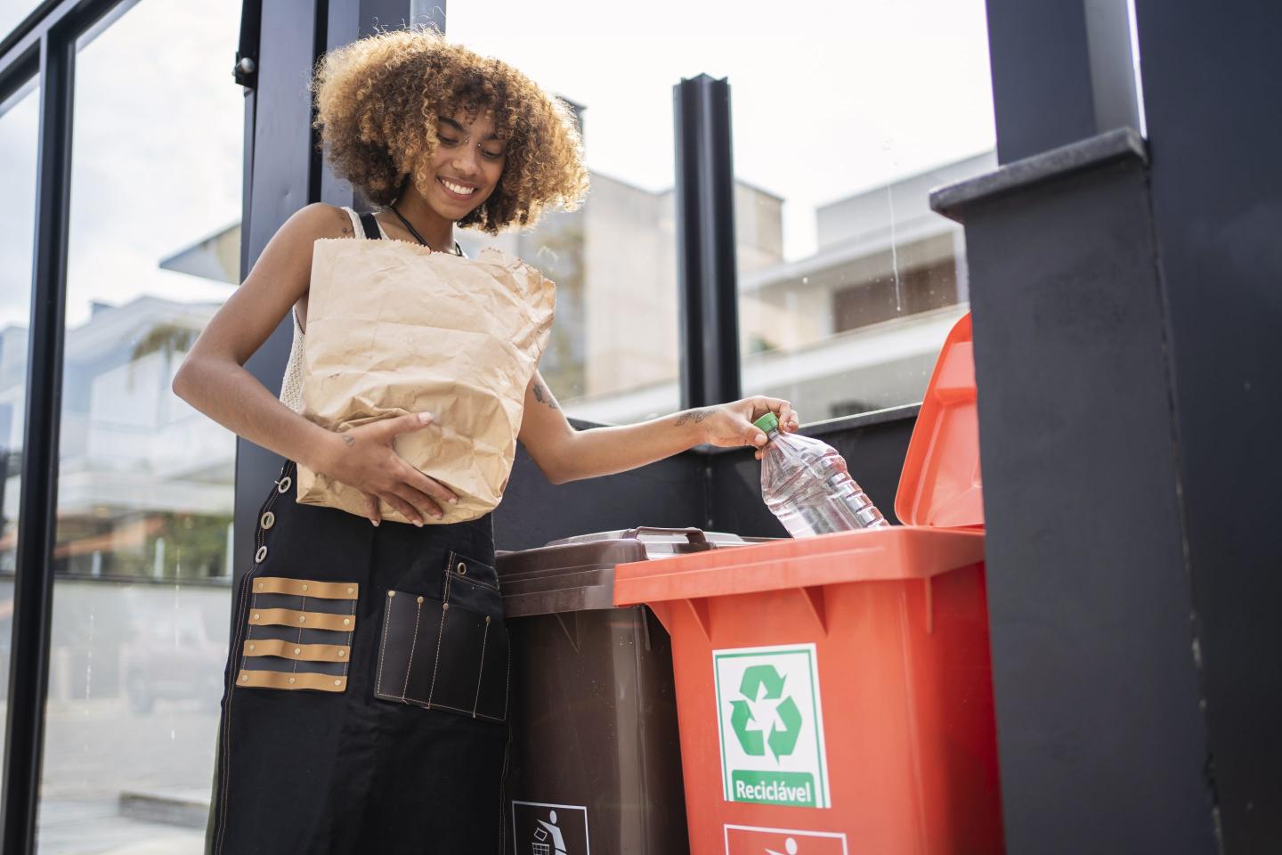 woman recycling bottles