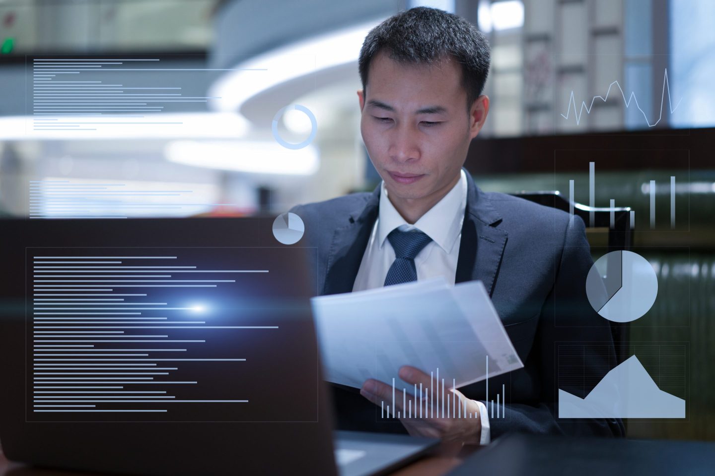Man sitting in front of charts
