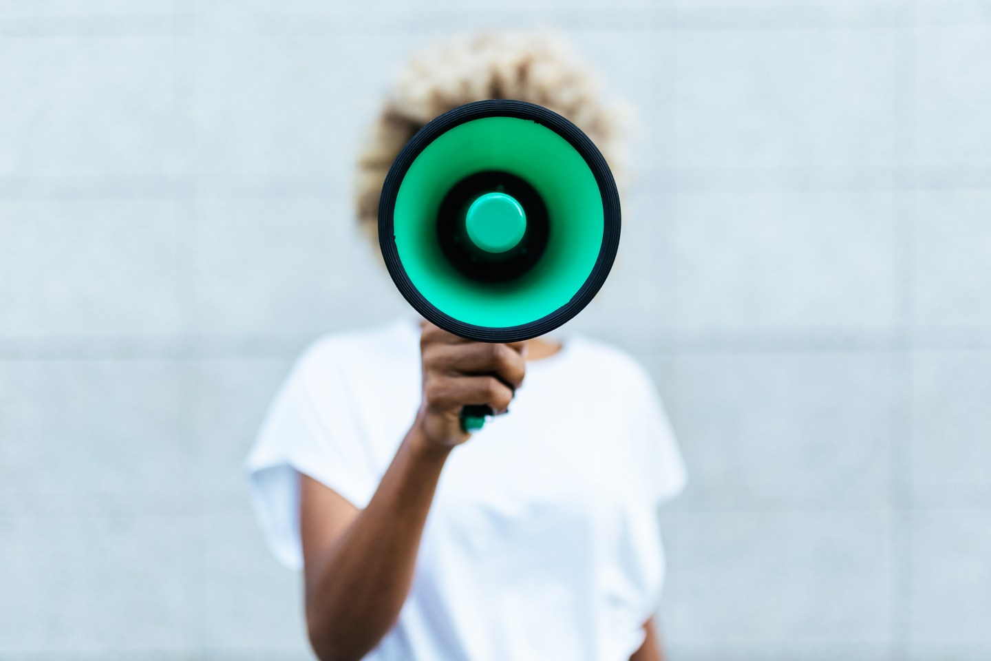 Woman shouting through megaphone