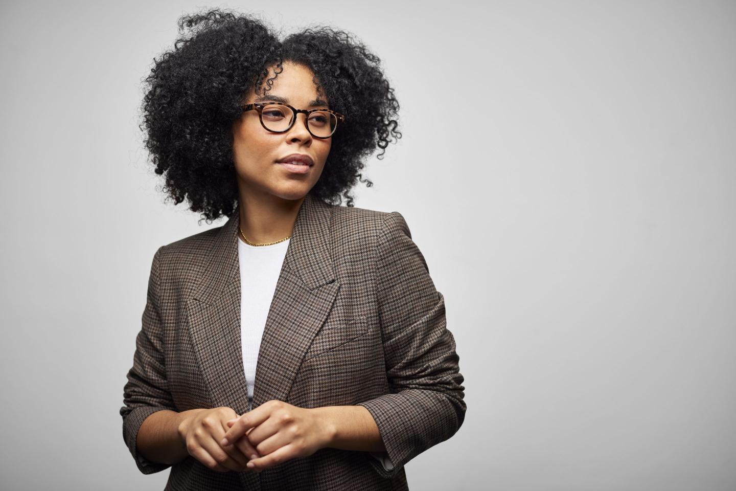 Confident African American Businesswoman Against White Background