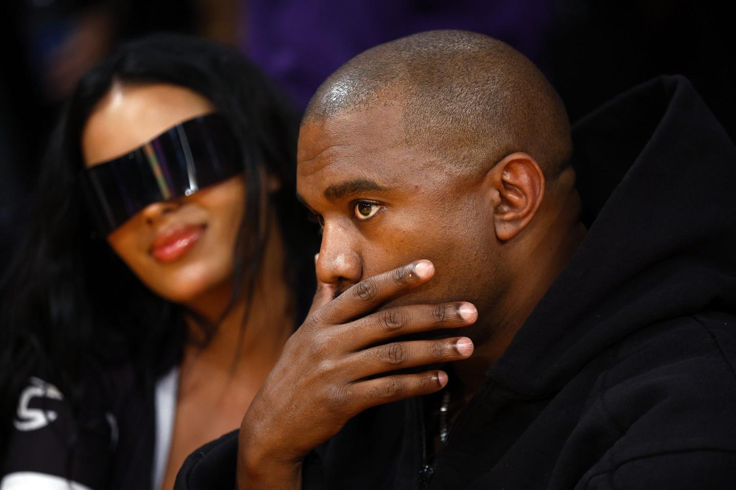Rapper Kanye West and girlfriend Chaney Jones attend a game between the Washington Wizards and the Los Angeles Lakers