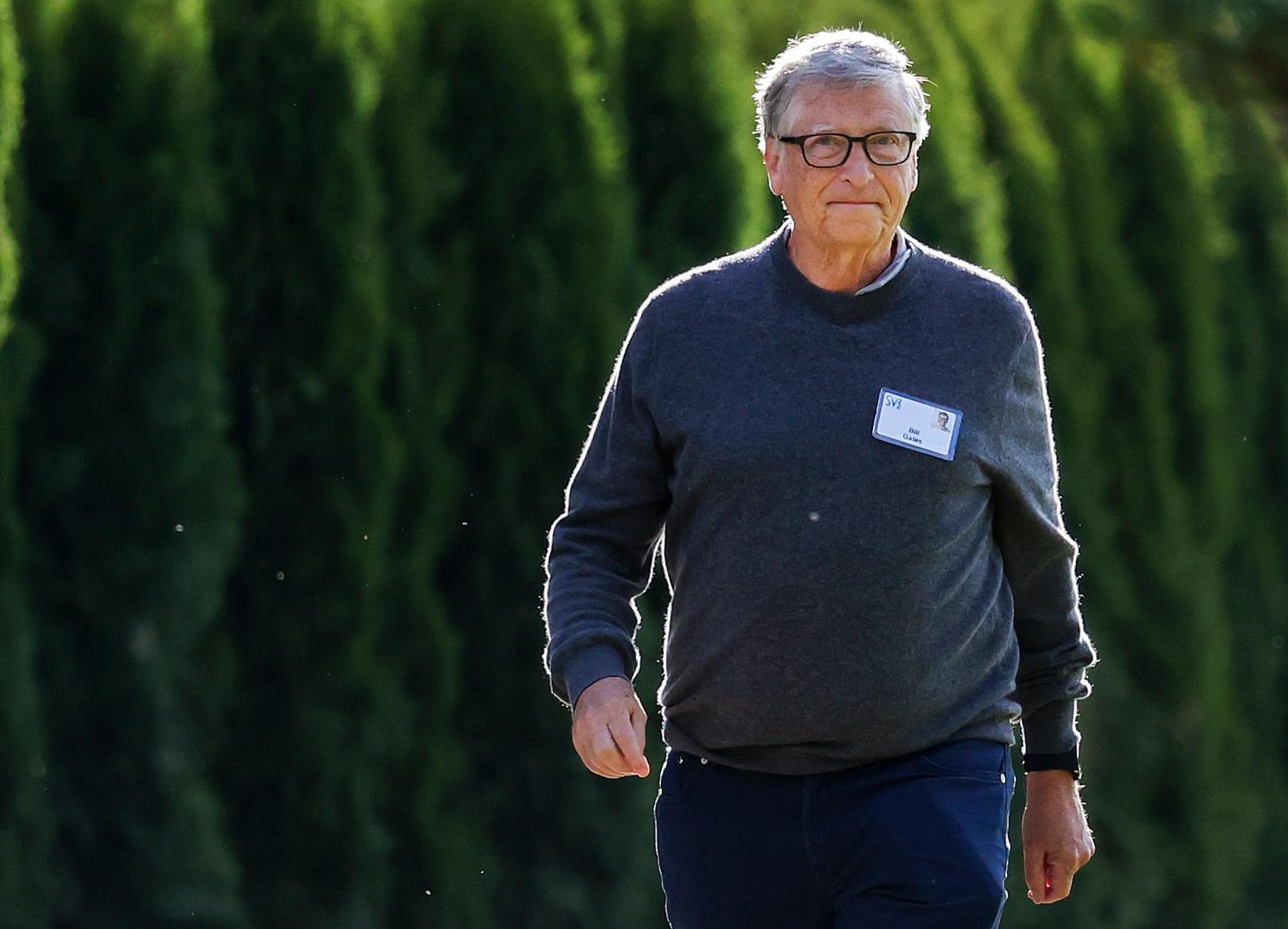 Bill Gates seen walking outdoors at a conference in Idaho.