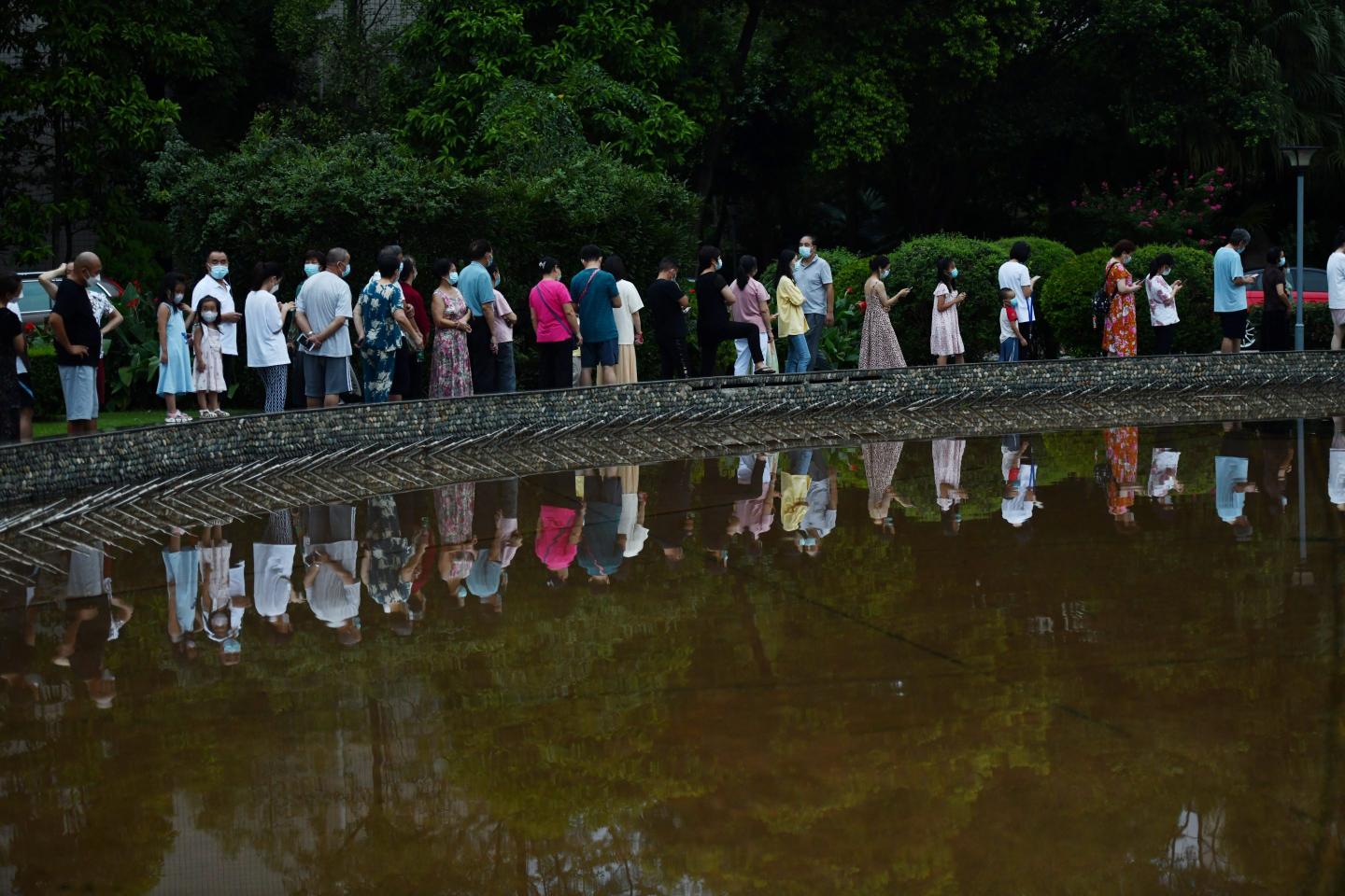 Residents queue up for COVID-19 nucleic acid tests at a gated community as Chengdu imposes city-wide static control to curb new COVID-19 outbreak on Sept. 1, 2022 in Chengdu, Sichuan Province of China.
