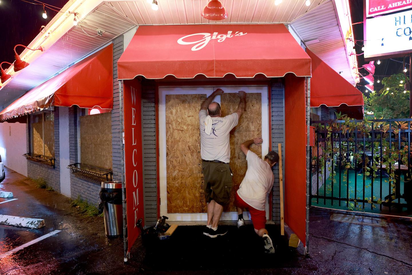 Business owners board up their windows
