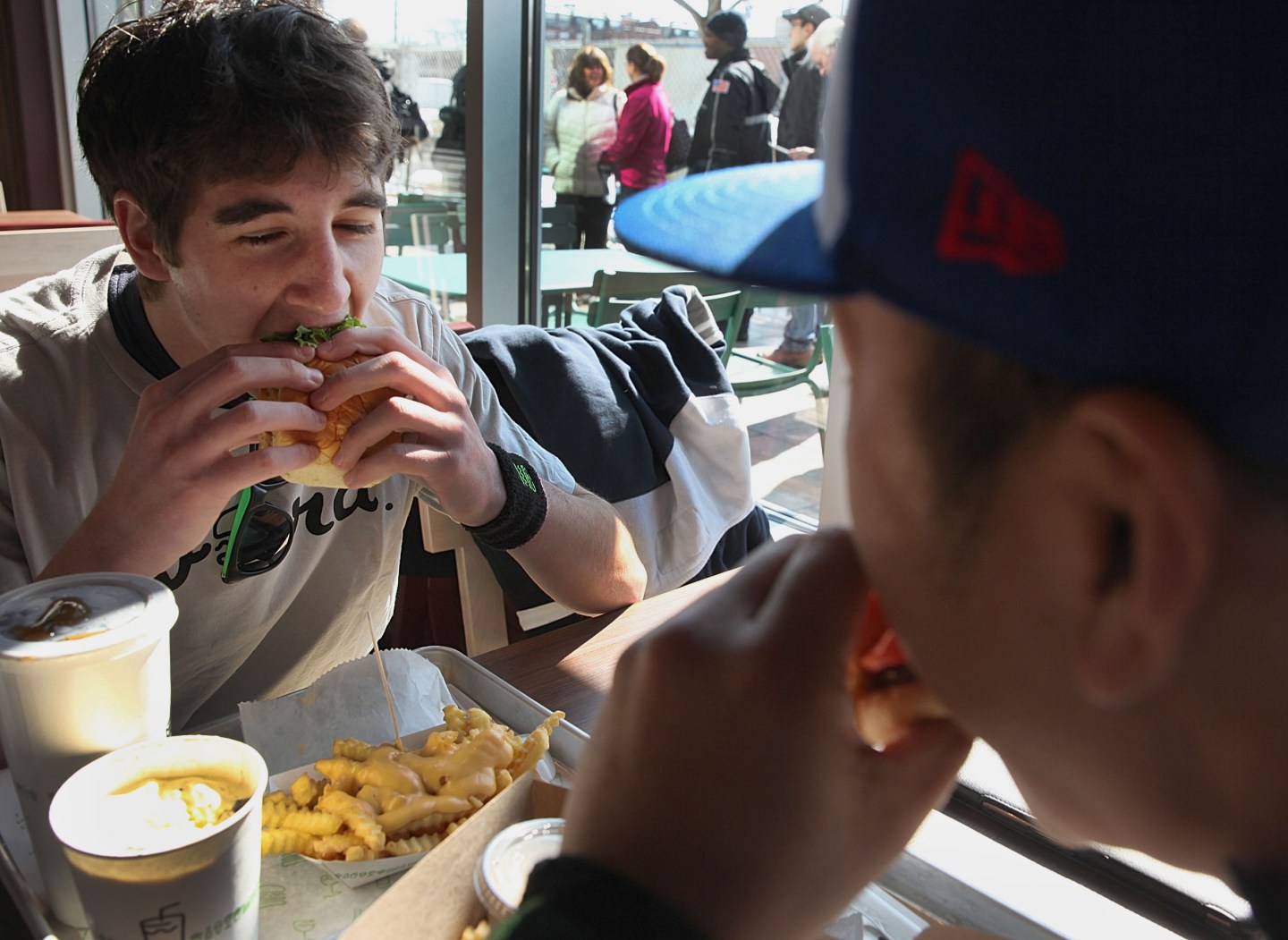 Diners enjoy a Shake Shack burger