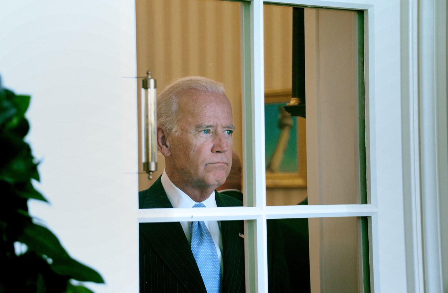 Joe Biden looks out of a window