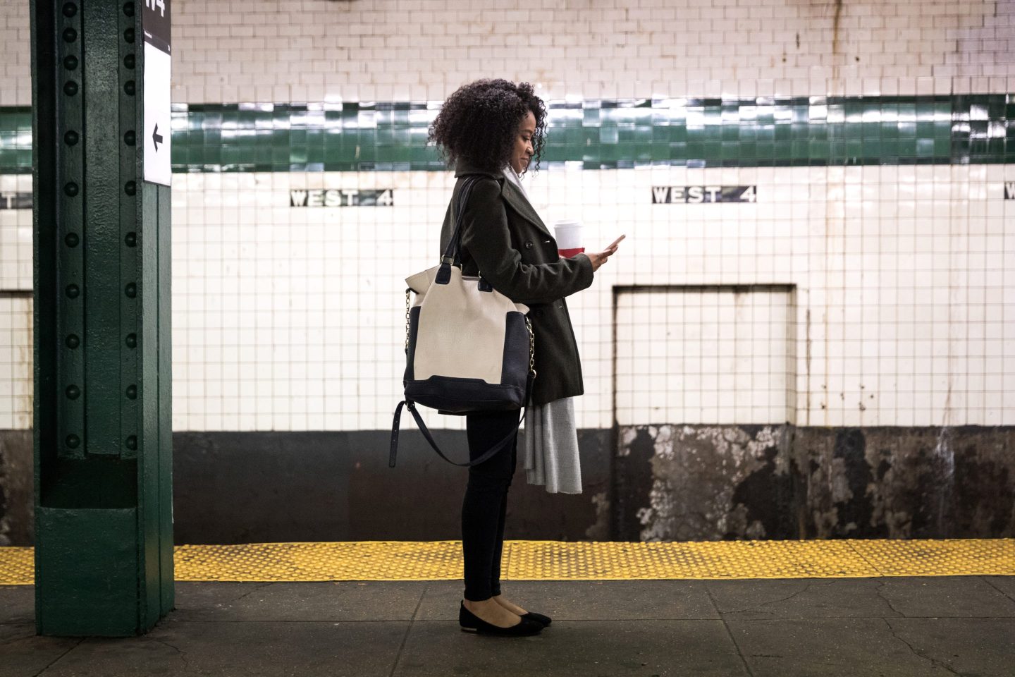 Young professional woman waiting for the subway