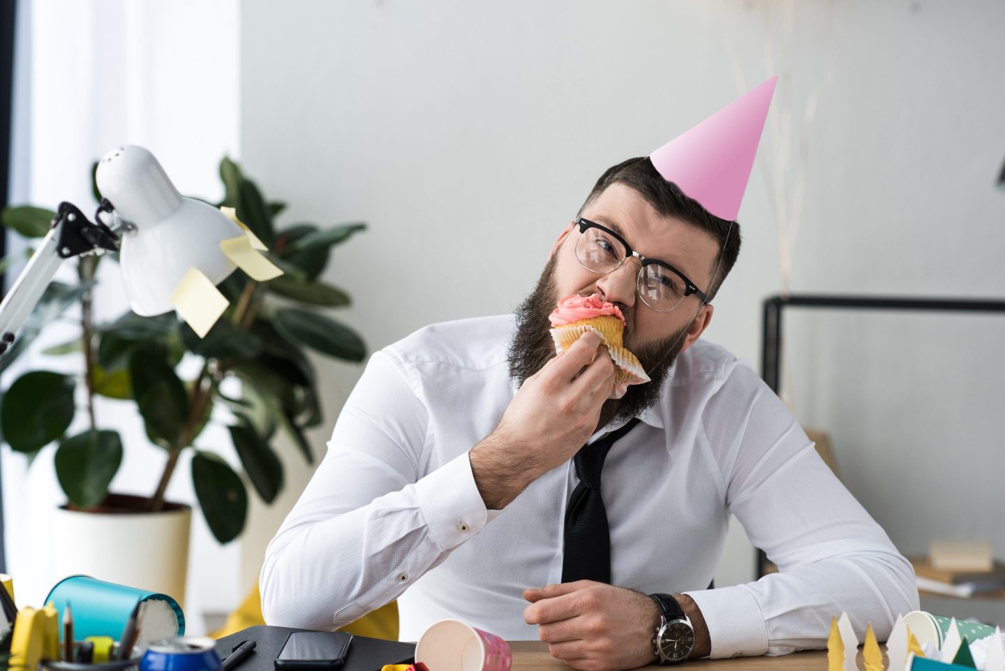 Businessman eats cake
