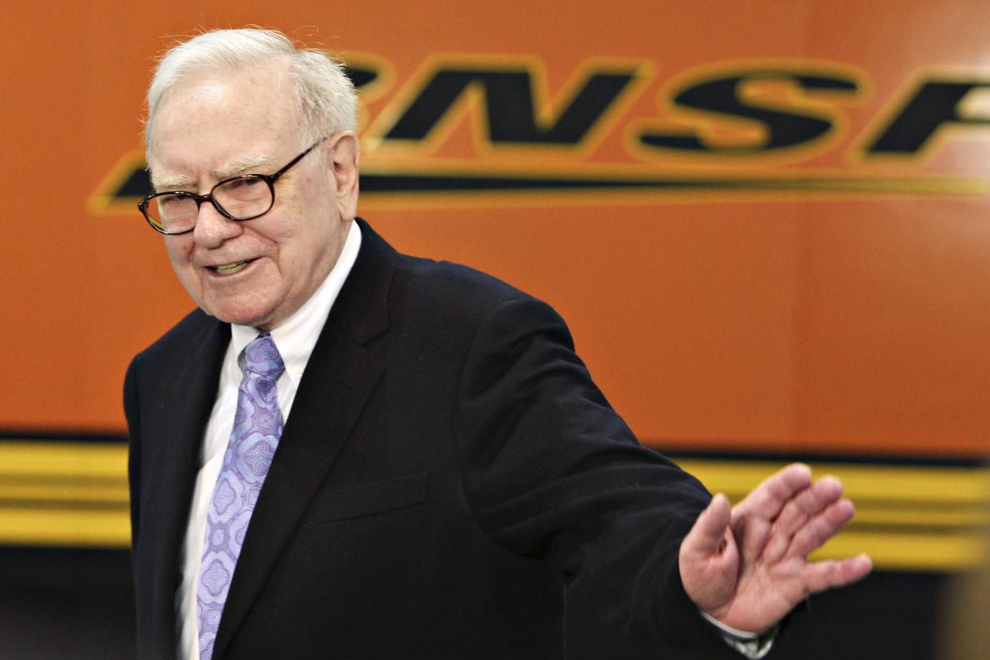 Berkshire Hathaway CEO Warren Buffett walks past a BNSF display at a 2010 exhibition in Omaha, Nebraska