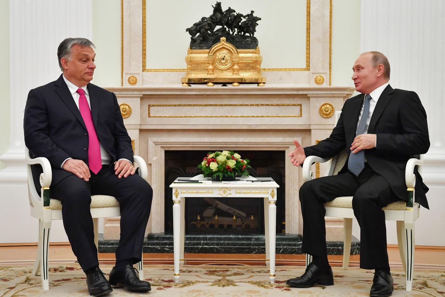 Wide shot of Hungary Prime Minister Viktor Orbán and Russian President Vladimir Putin speaking in the Kremlin in Moscow.