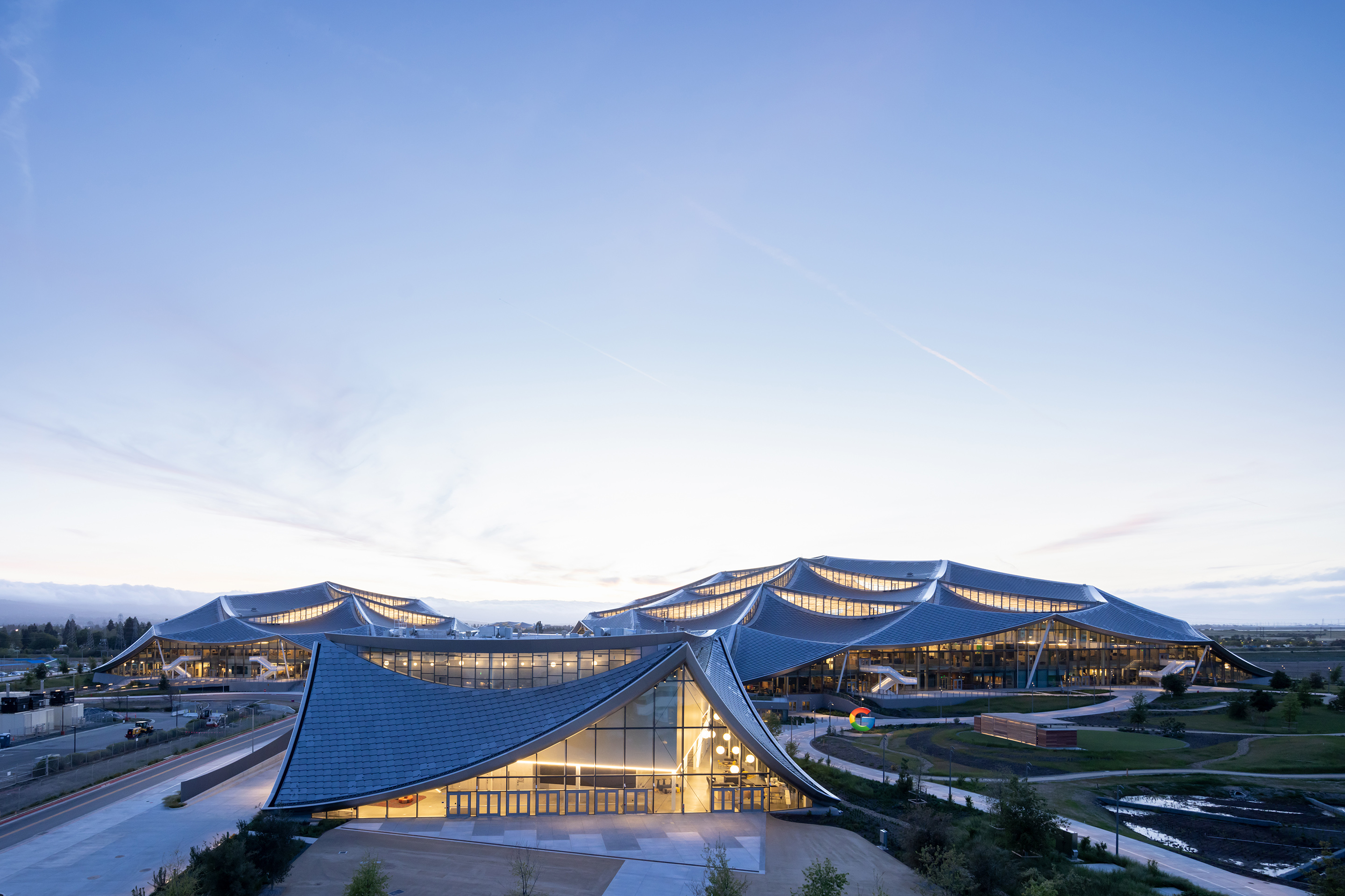 Google's Bay View campus in Mountain View, Calif., was built with its sustainability goals in mind and features 90,000 solar panels, nearby wind farms, and all-electric kitchens.