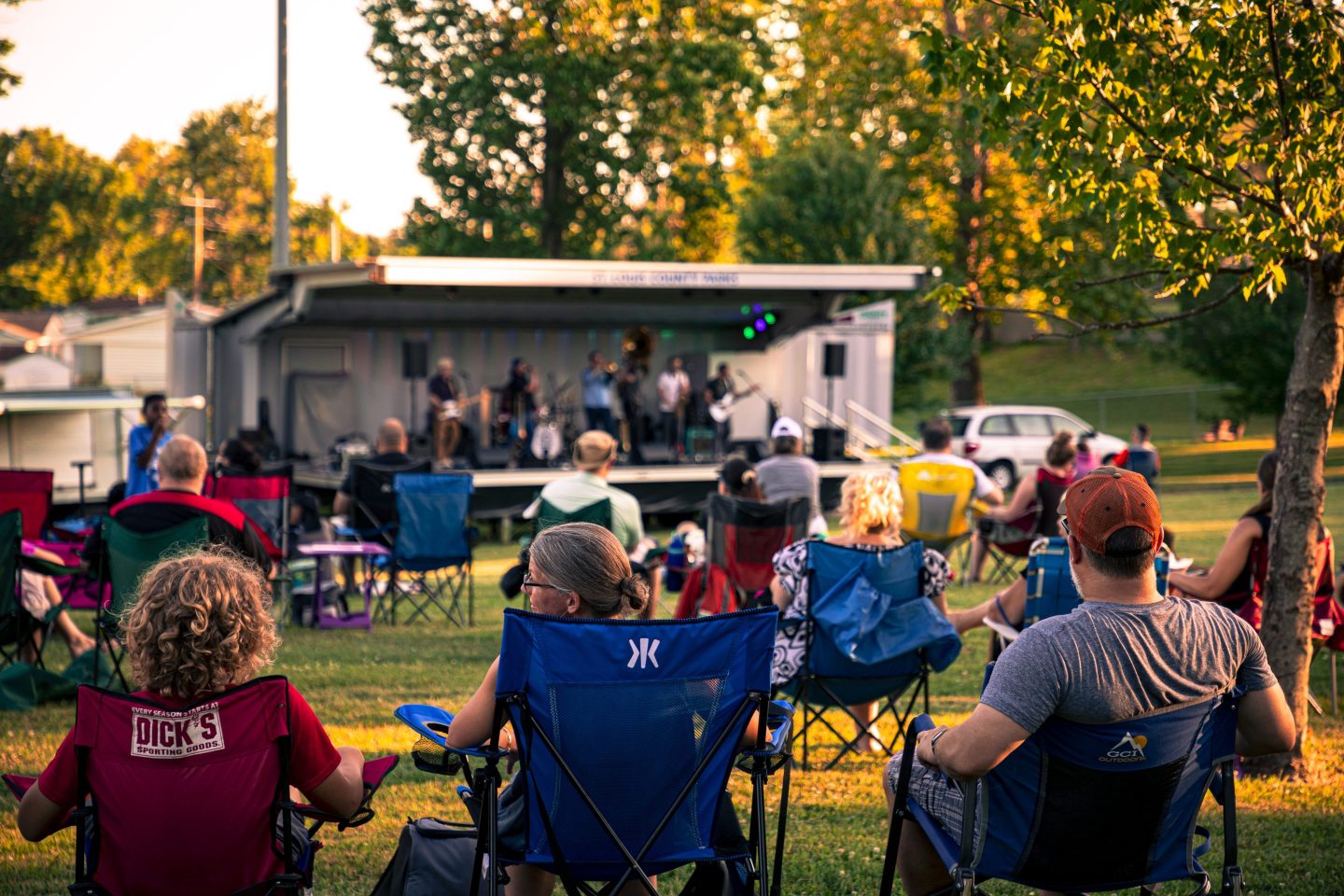 Residents relax after the workweek with live music in a neighborhood park.