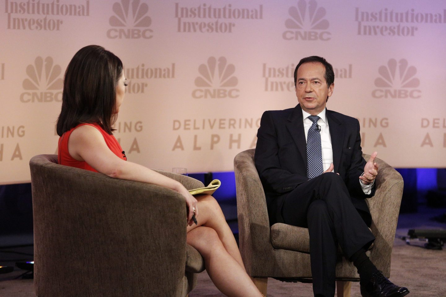 CNBC's Melissa Lee interviews John Paulson at the CNBC Institutional Investor Delivering Alpha Conference in New York in 2014.