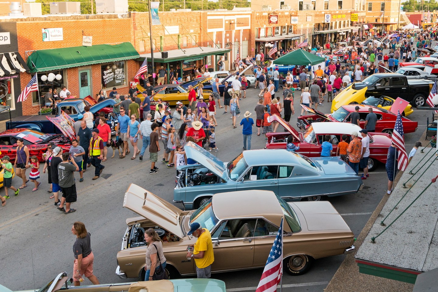 People walk through downtown Wylie during a car show.