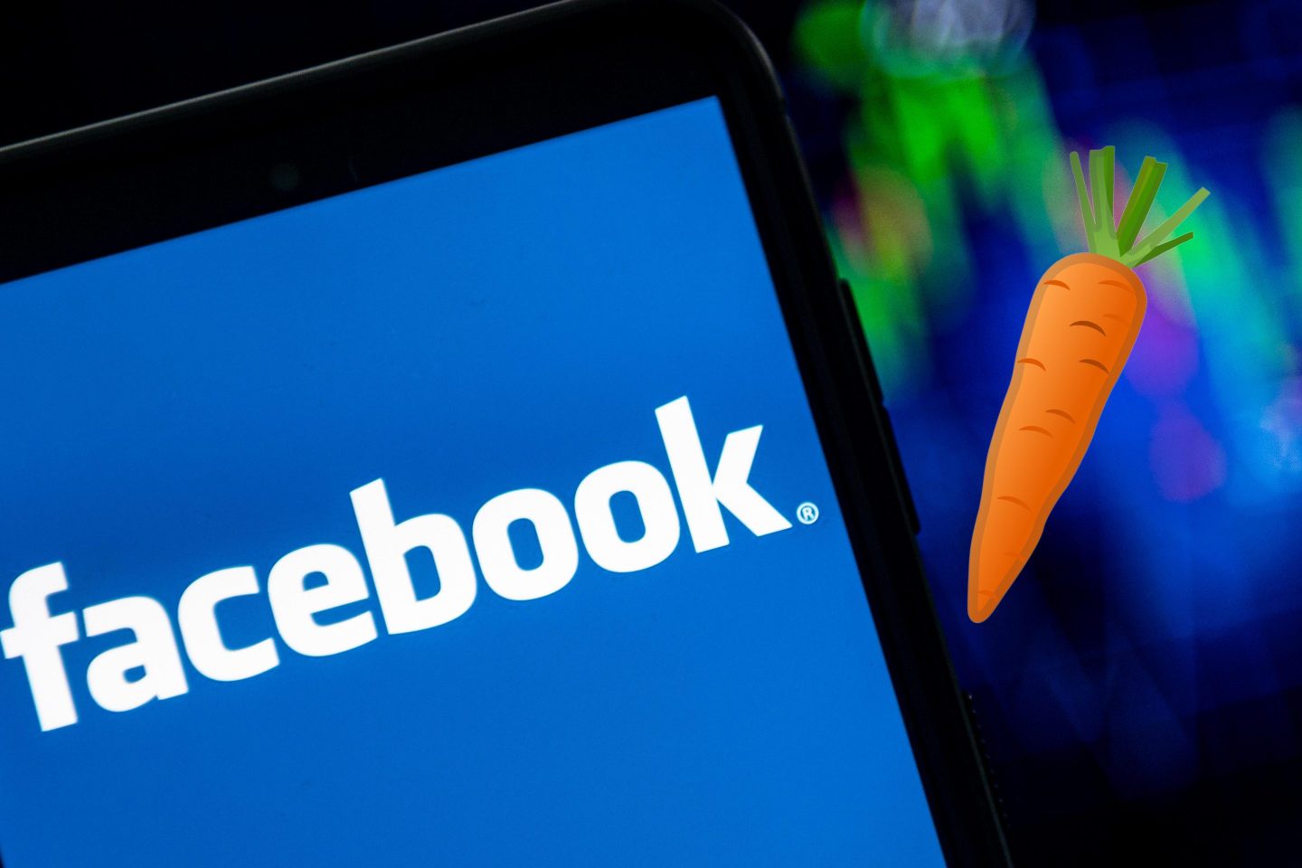 Facebook logo seen displayed on a smartphone. Carrot Emoji