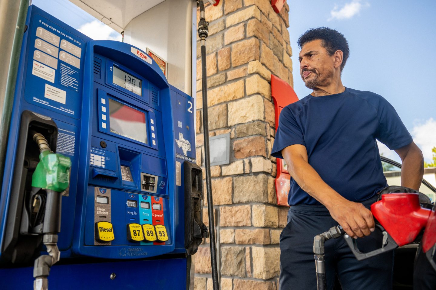 A customer pumps gas at an Exxon gas station on July 29, 2022 in Houston, Texas.