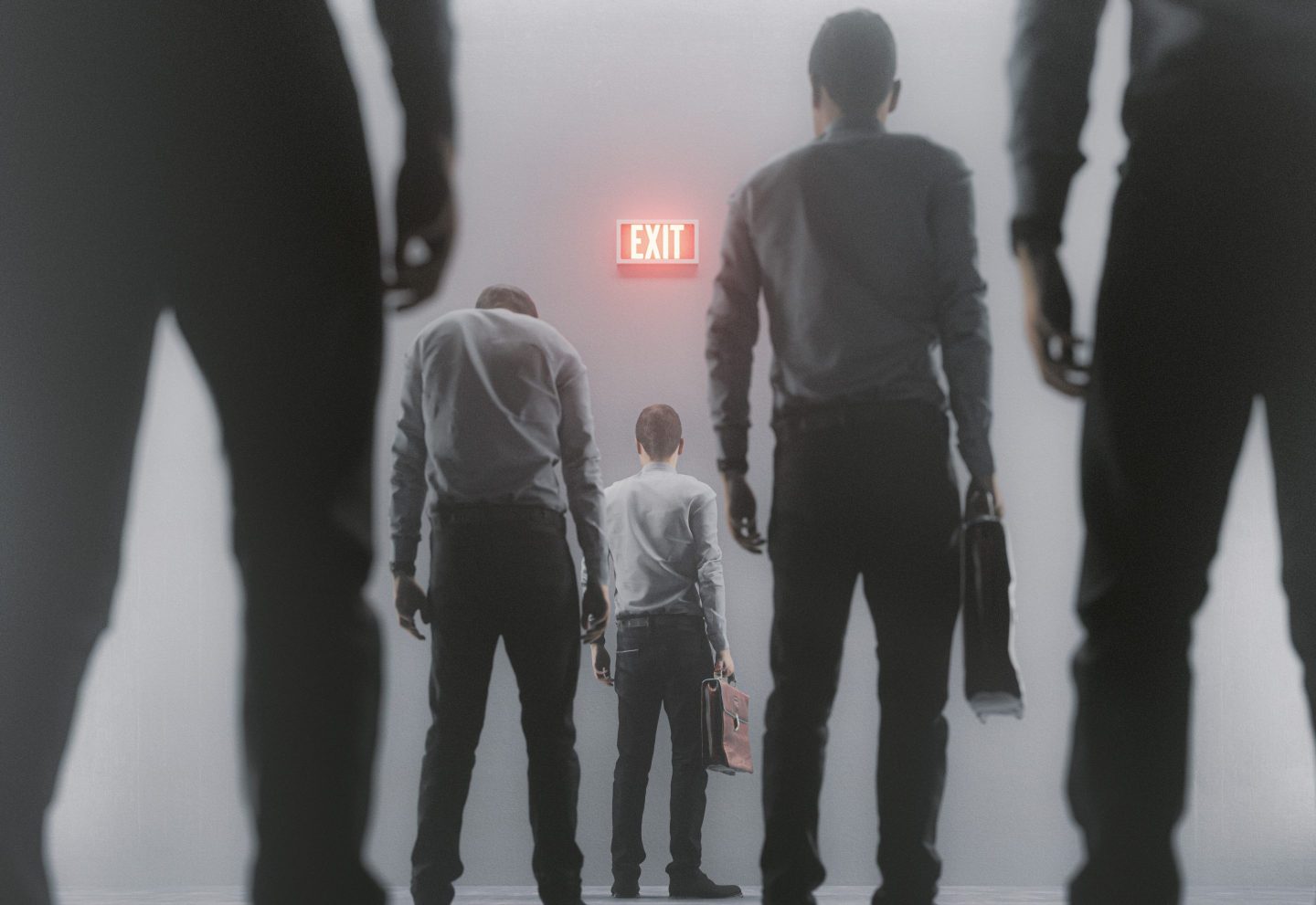 Several people walking stiffly toward an exit